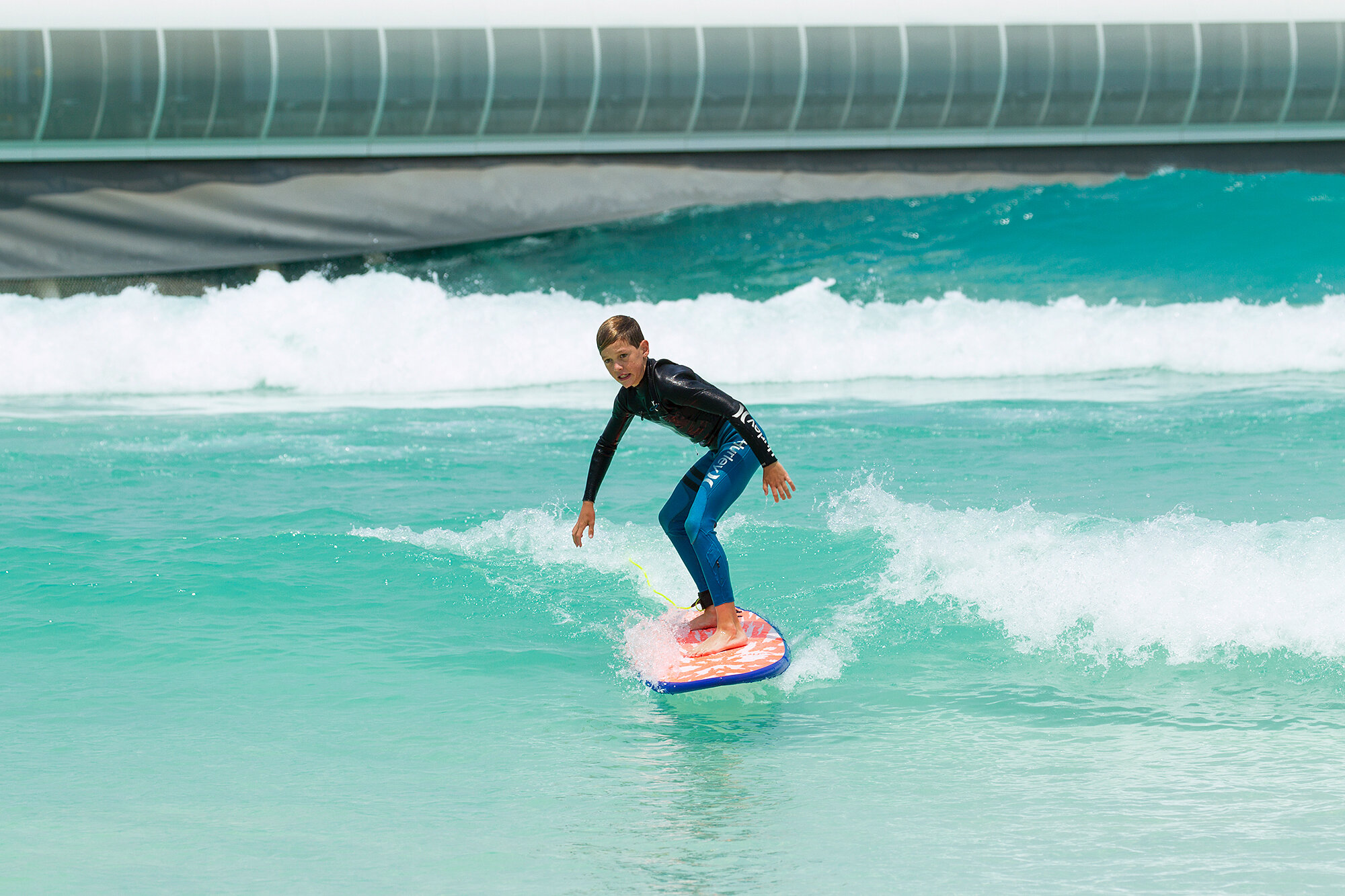Andrew's son Lochie has a crack at the Bay to celebrate the first day of surfing at UrbnSurf