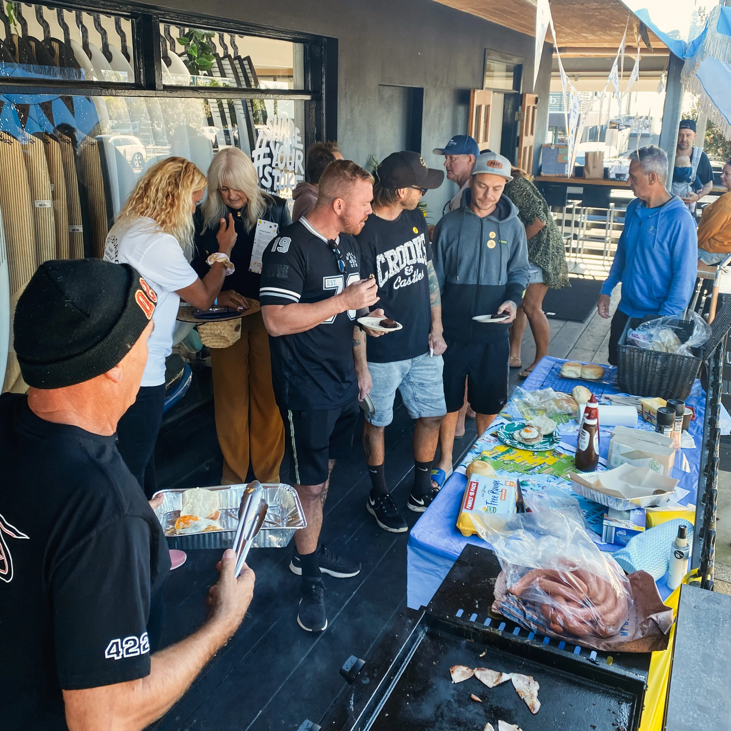Palm Beach locals take advantage of a free post-surf feed at the Surfboard Warehouse