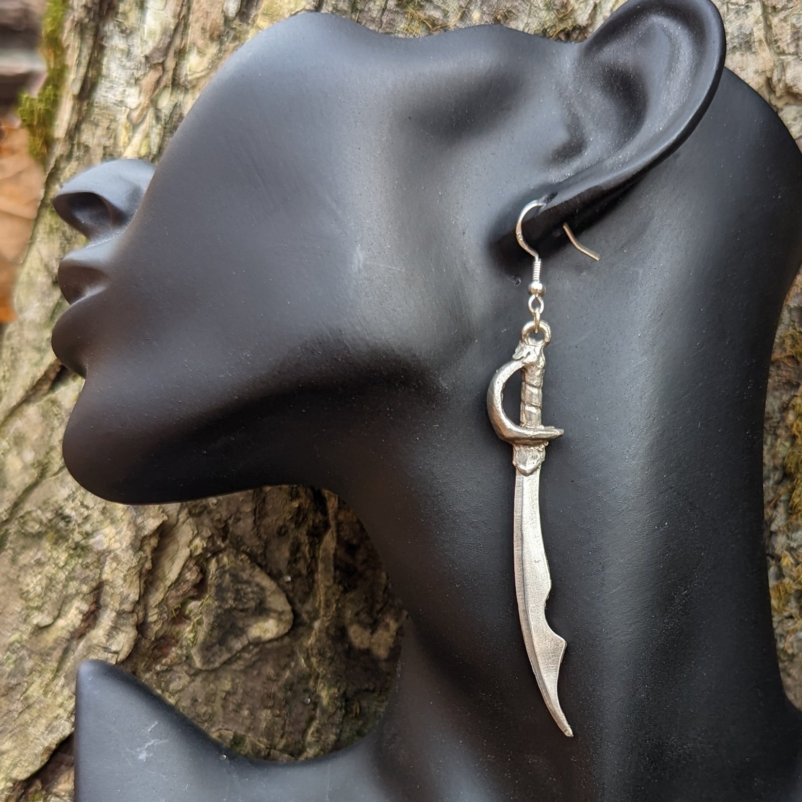 Cutlass earring, carved and cast by hand