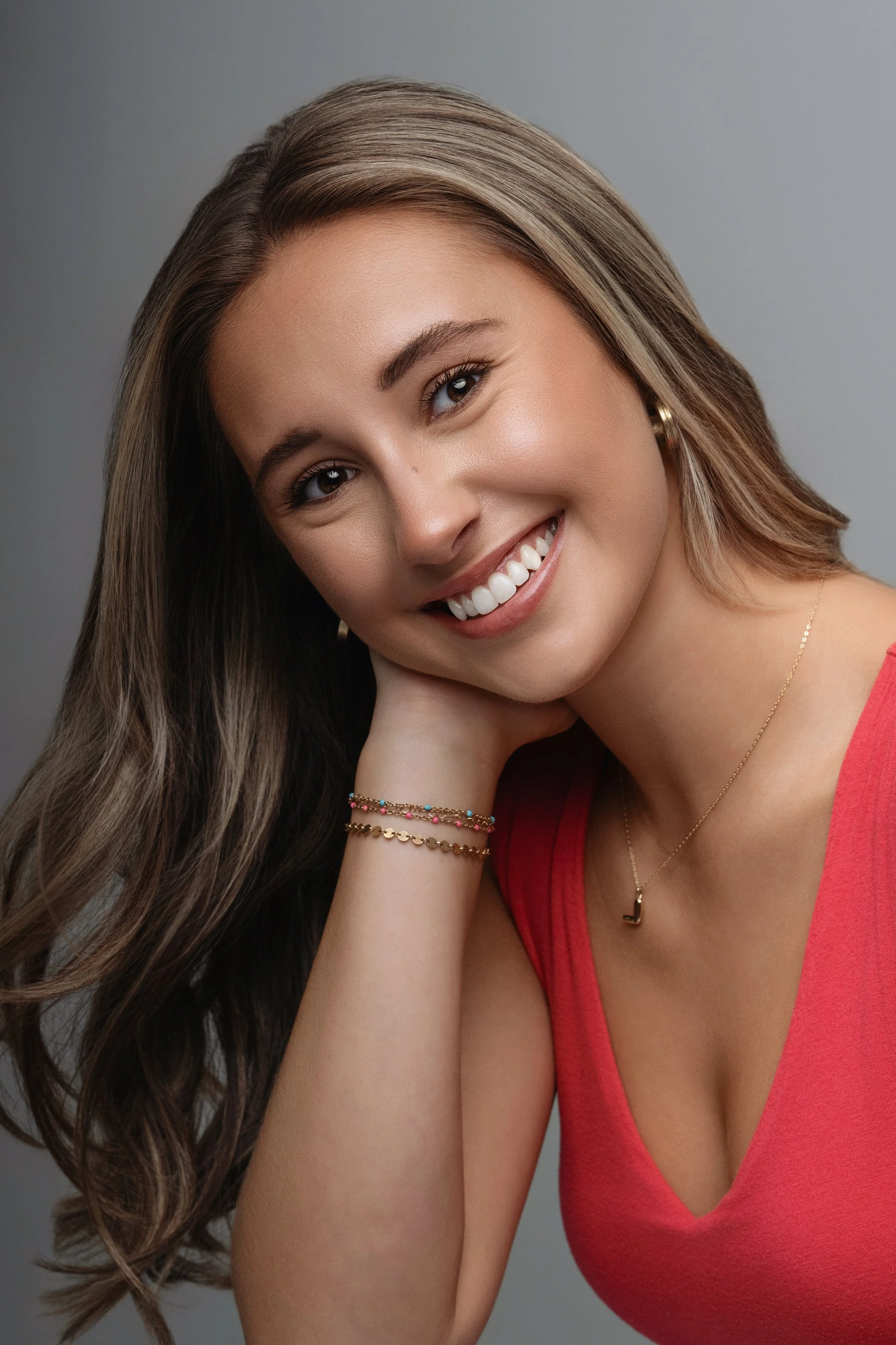 Modern senior portrait photographer capturing natural beauty with soft studio lighting and modern styling. 