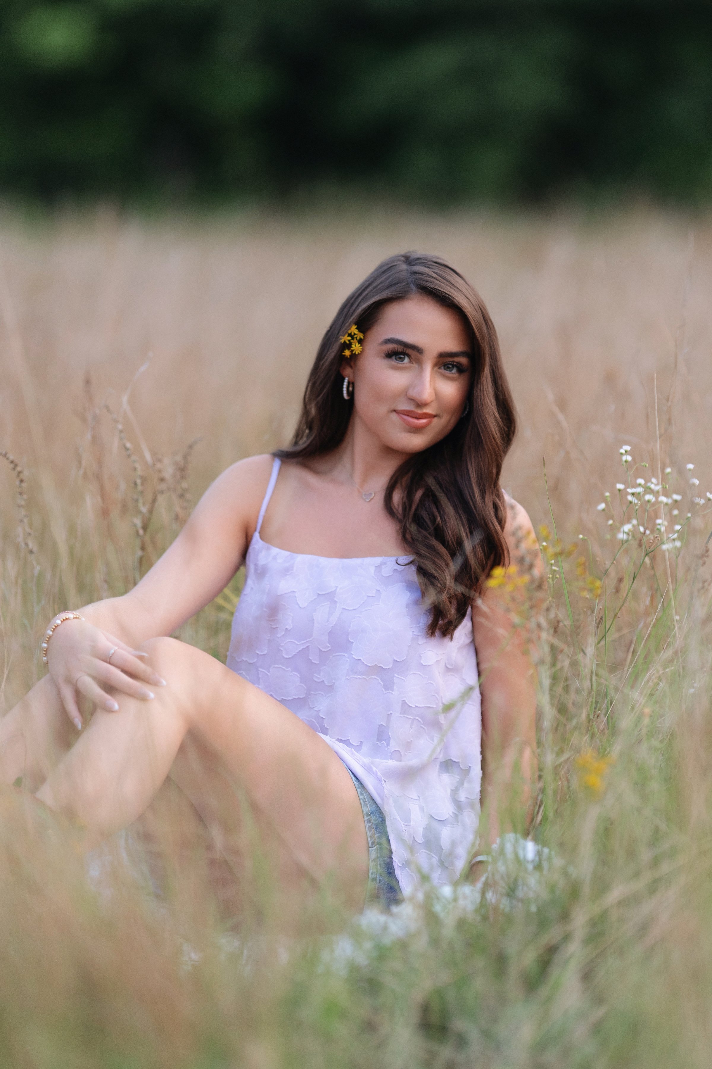 Myrtle Beach Senior photographer creating natural, light-filled outdoor portraits in a golden field setting. 