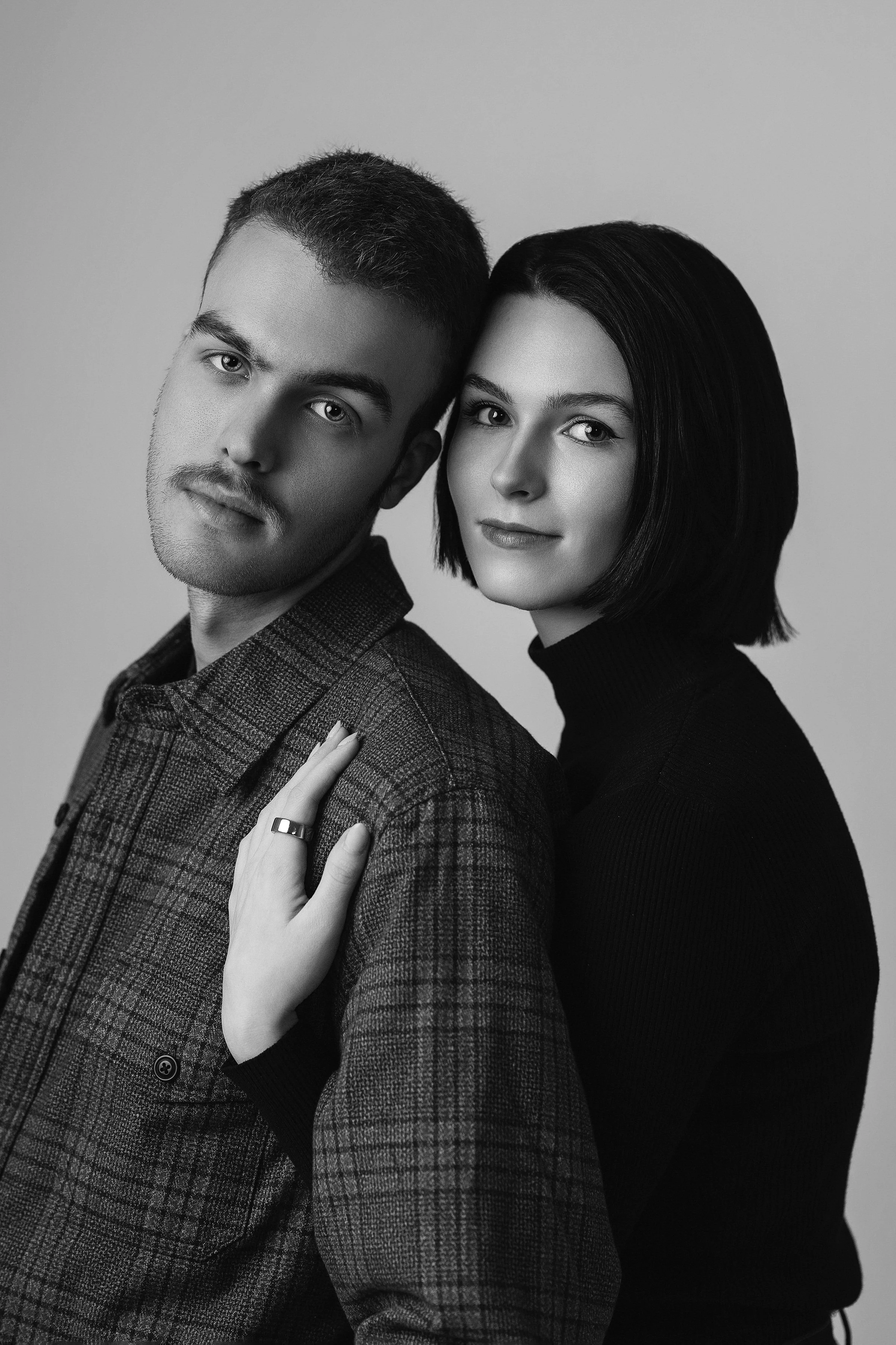 Black and white couple portrait in North Myrtle Beach studio capturing authentic connection by Sommer Ortiz.