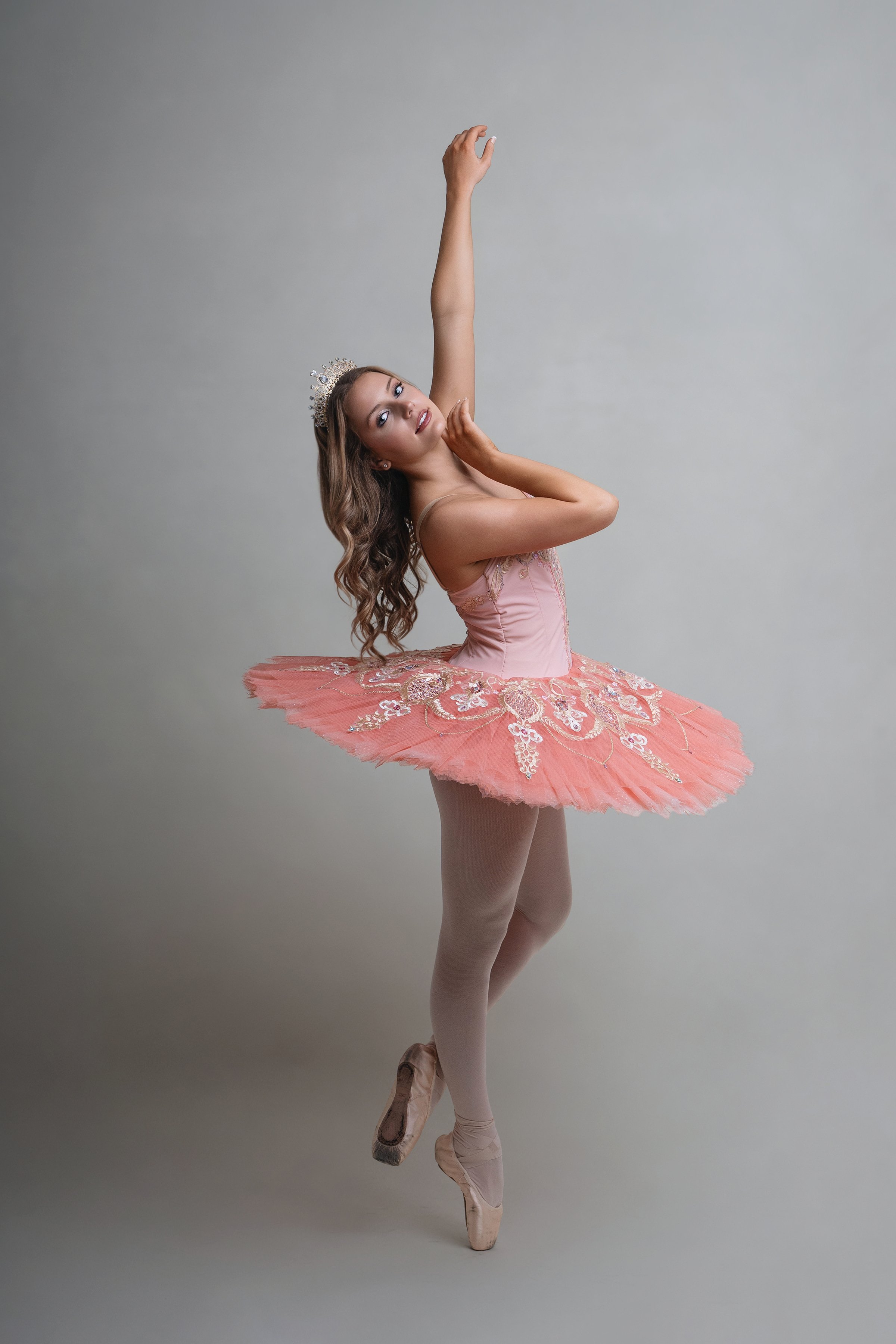 Studio ballet portrait in North Myrtle Beach featuring dancer en pointe in soft pink tutu.