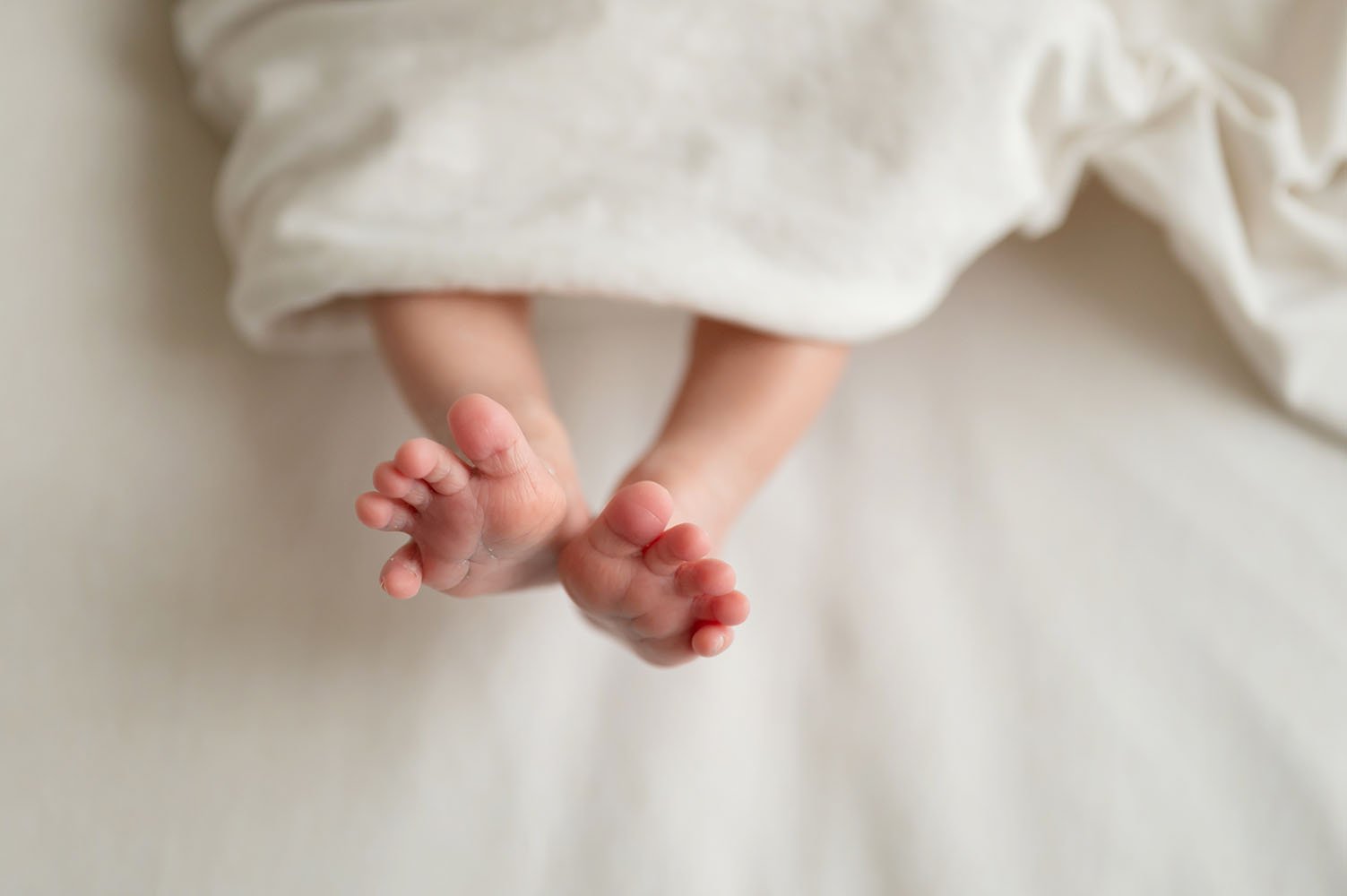 Fotografia neonato piedini