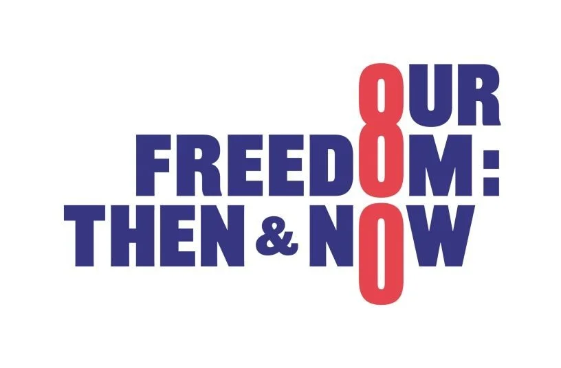 Text graphic reading "Our freedom: then & now" with the words 'then' and 'now' in blue and the word 'our' in red, and the repeated word 'freedom' in bold blue letters.