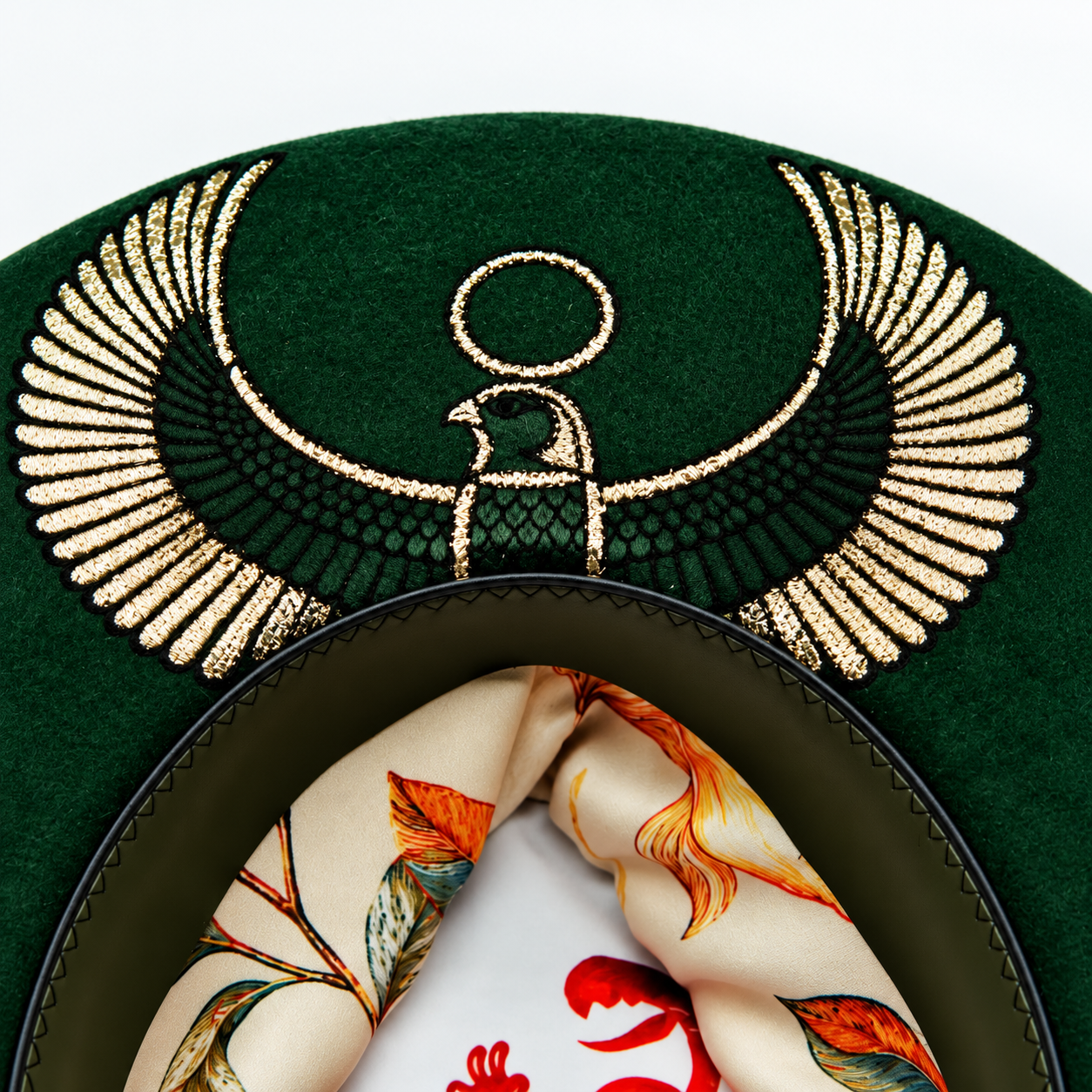 Embroidered Horus Crest on Green Felt Hat.png