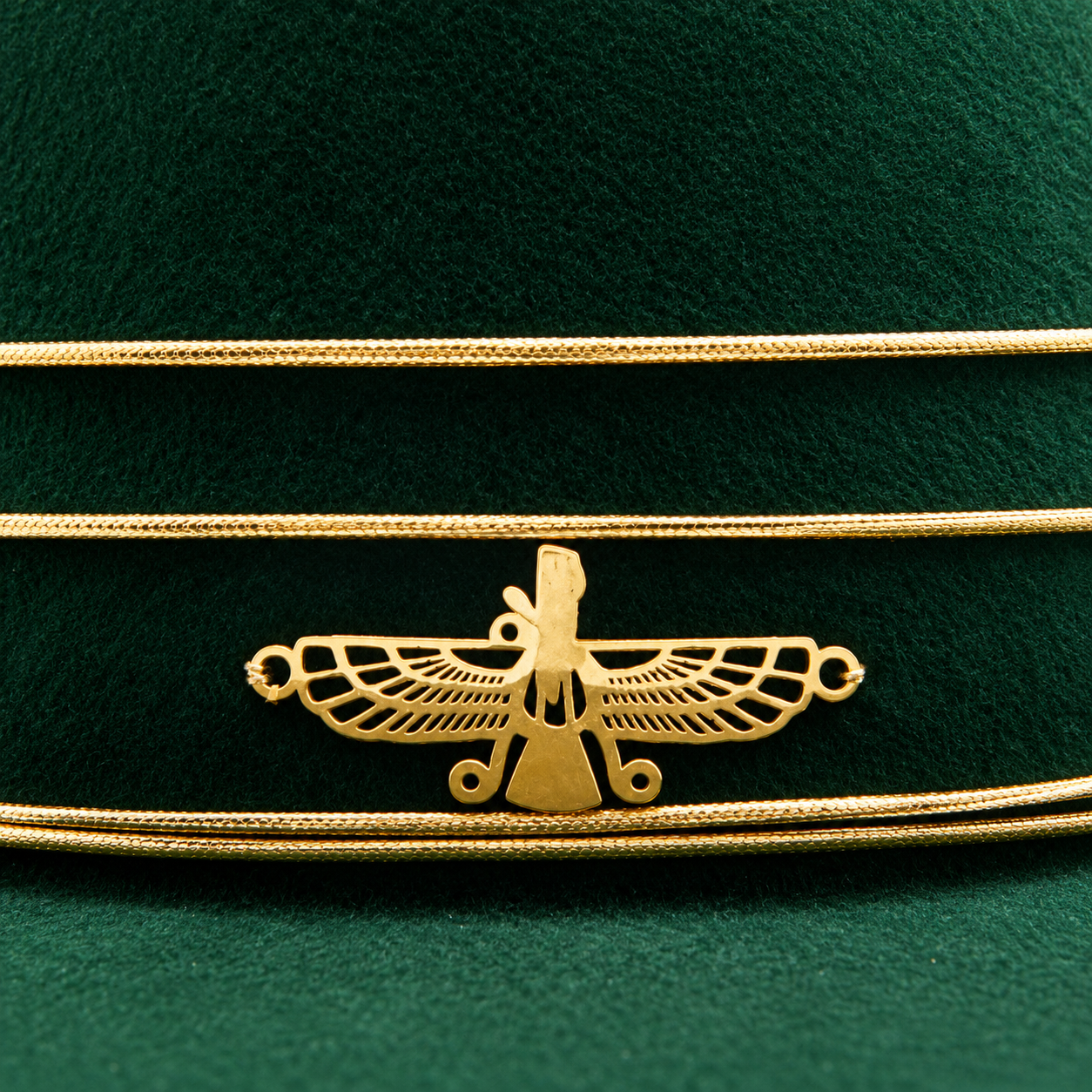 Golden Thunderbird Emblem on Green Velvet.png