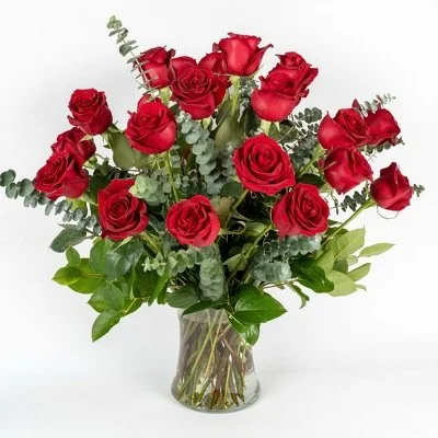 2 dozen red roses and greenery floral arrangement in a vase