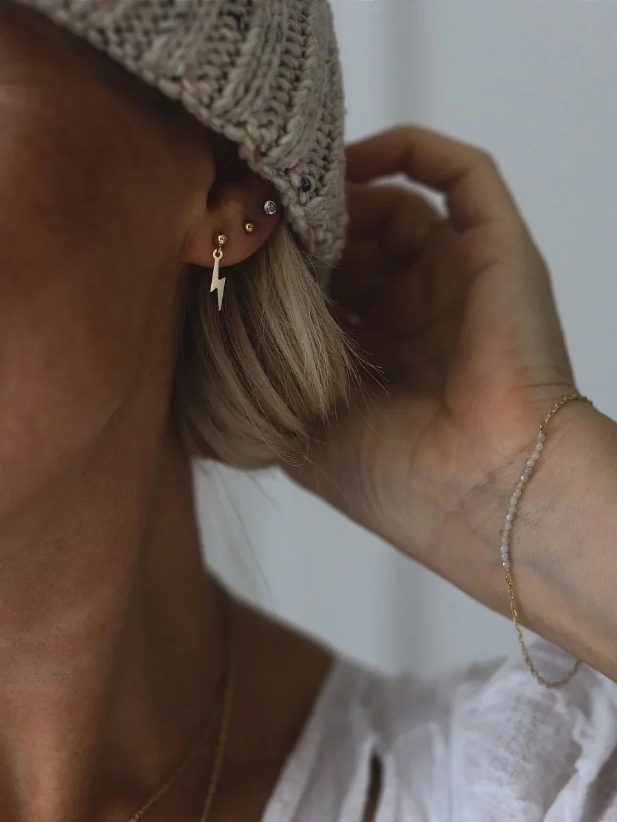Solid gold stud earrings, with seed pearls, sapphires, diamonds and white topaz.
#conflictfree #solidgold #studearrings #lightningboltearrings #thunderboltjewellery #jewellery #jewelry #earstack #diamondstuds #naturaldiamonds #sapphirestuds #pearlst
