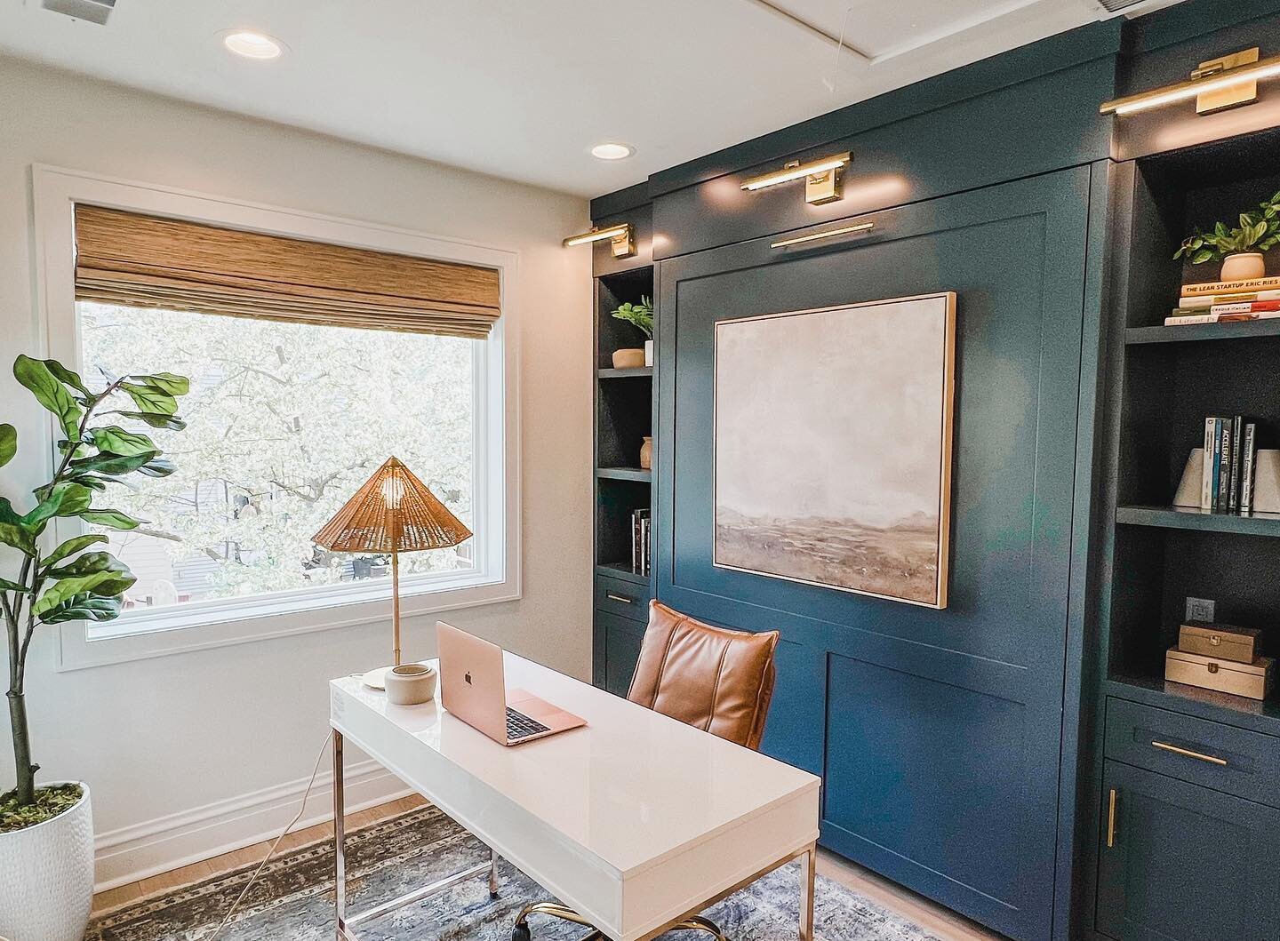 One of the most common design requests I get is for a home office that can also function as a guest room. I love that this custom Murphy bed takes up minimal space and also provides a beautiful pop of color (Sea Serpent by SW). The sconces and art ma