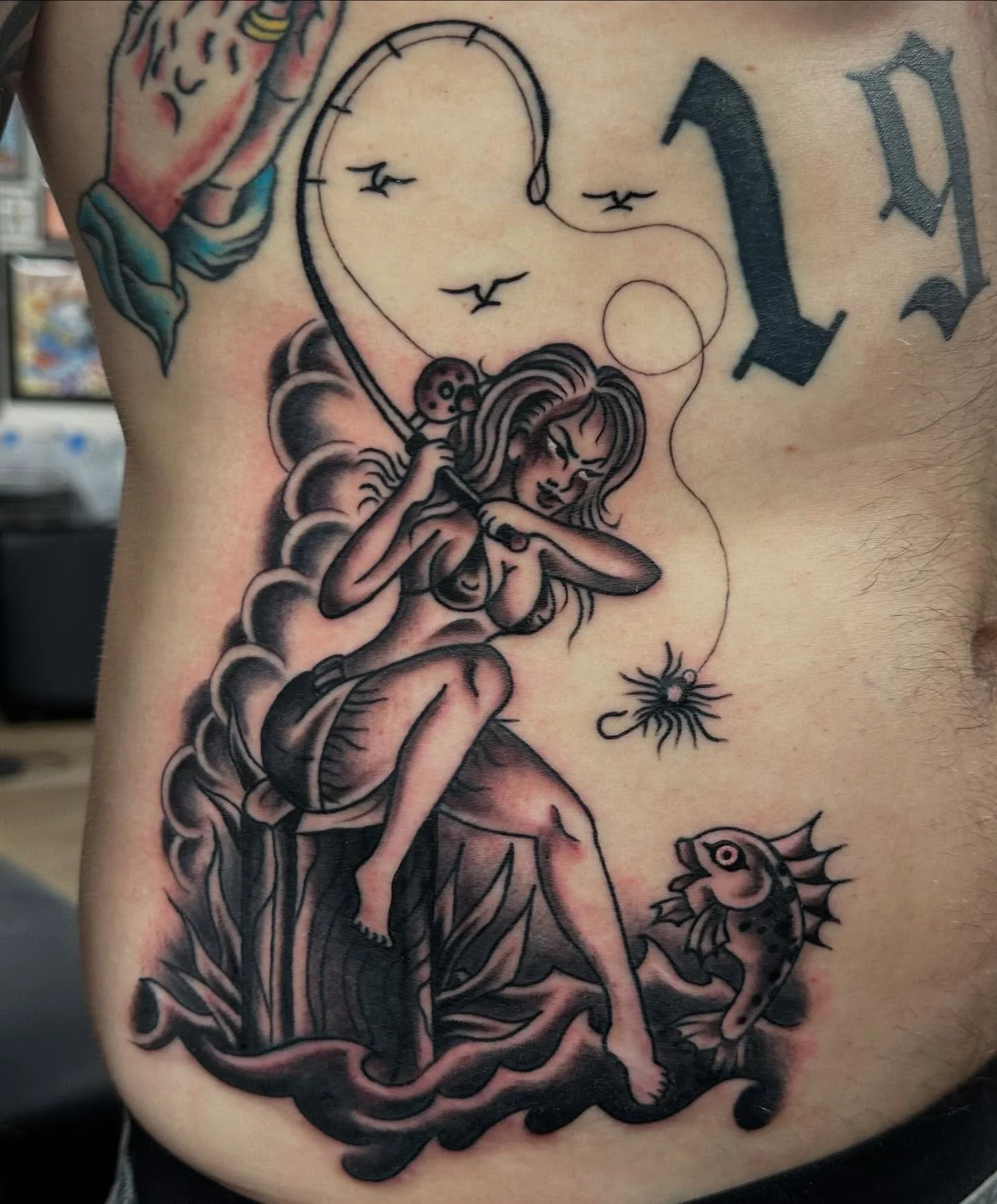 🎣 by @today.jr #blackandgreytattoo #spokanetattooshop #spokaneart #ironandgoldtattoo #spokanetattoo #fishingtattoo