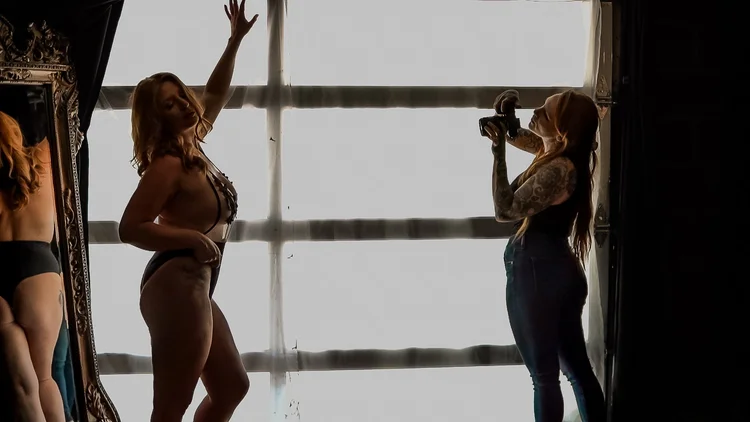 Brii Cherri photographing client during boudoir session at The Boudoir Studio North Carolina