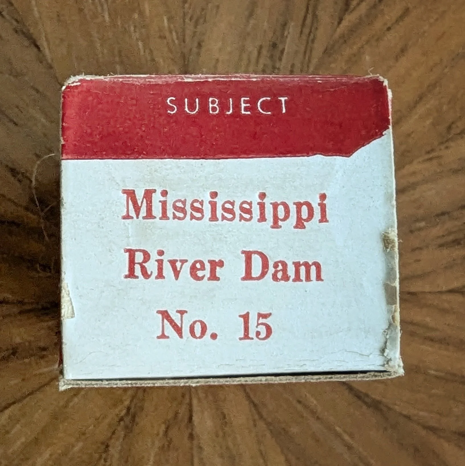 Box #2 (variation). Bright white with title typeset in red.