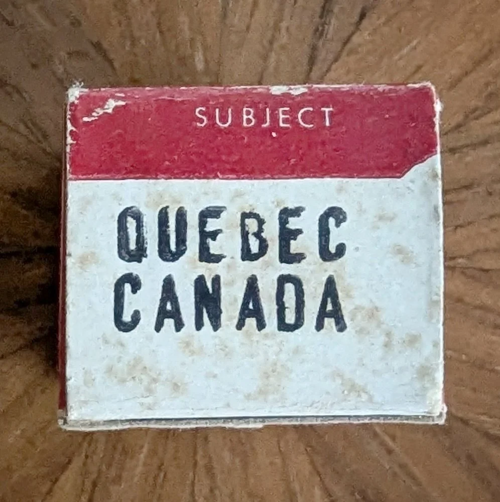 Box #2 (variation). Bright white with black sans-serif title stamp.