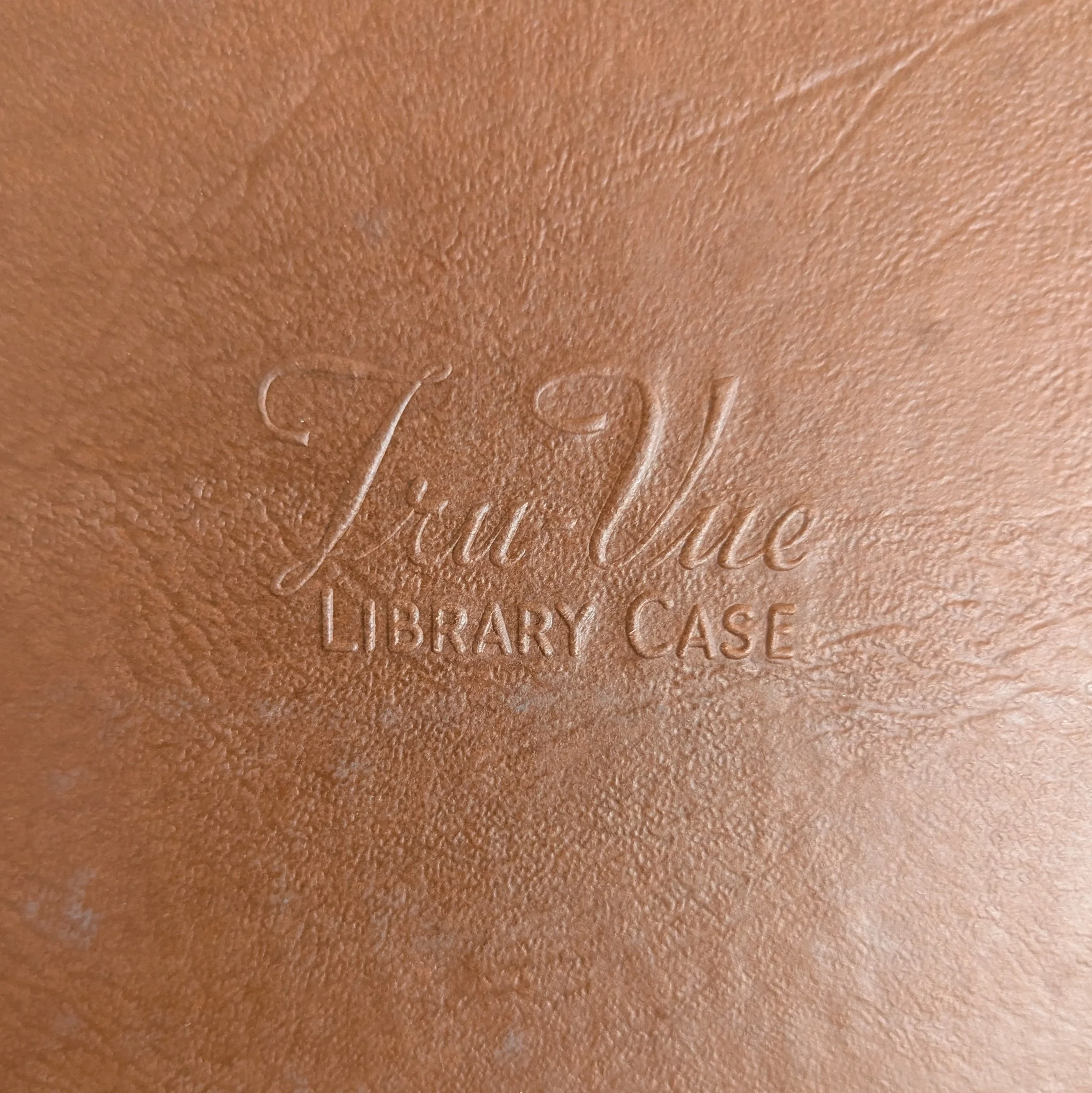 Tru-Vue name embossed on inside of lid
