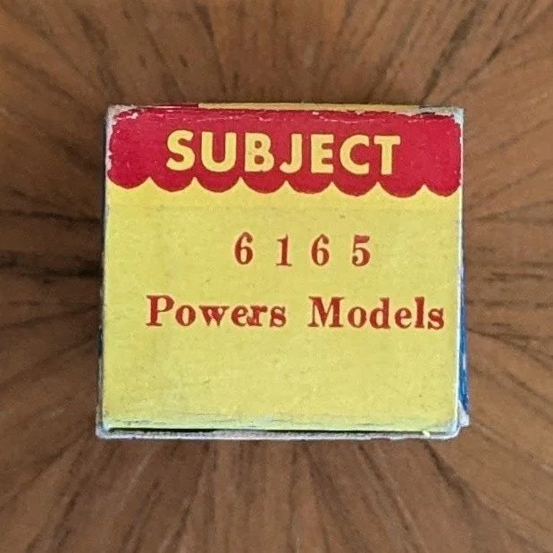 Box #6. Stereochrome color film box with red serif type.