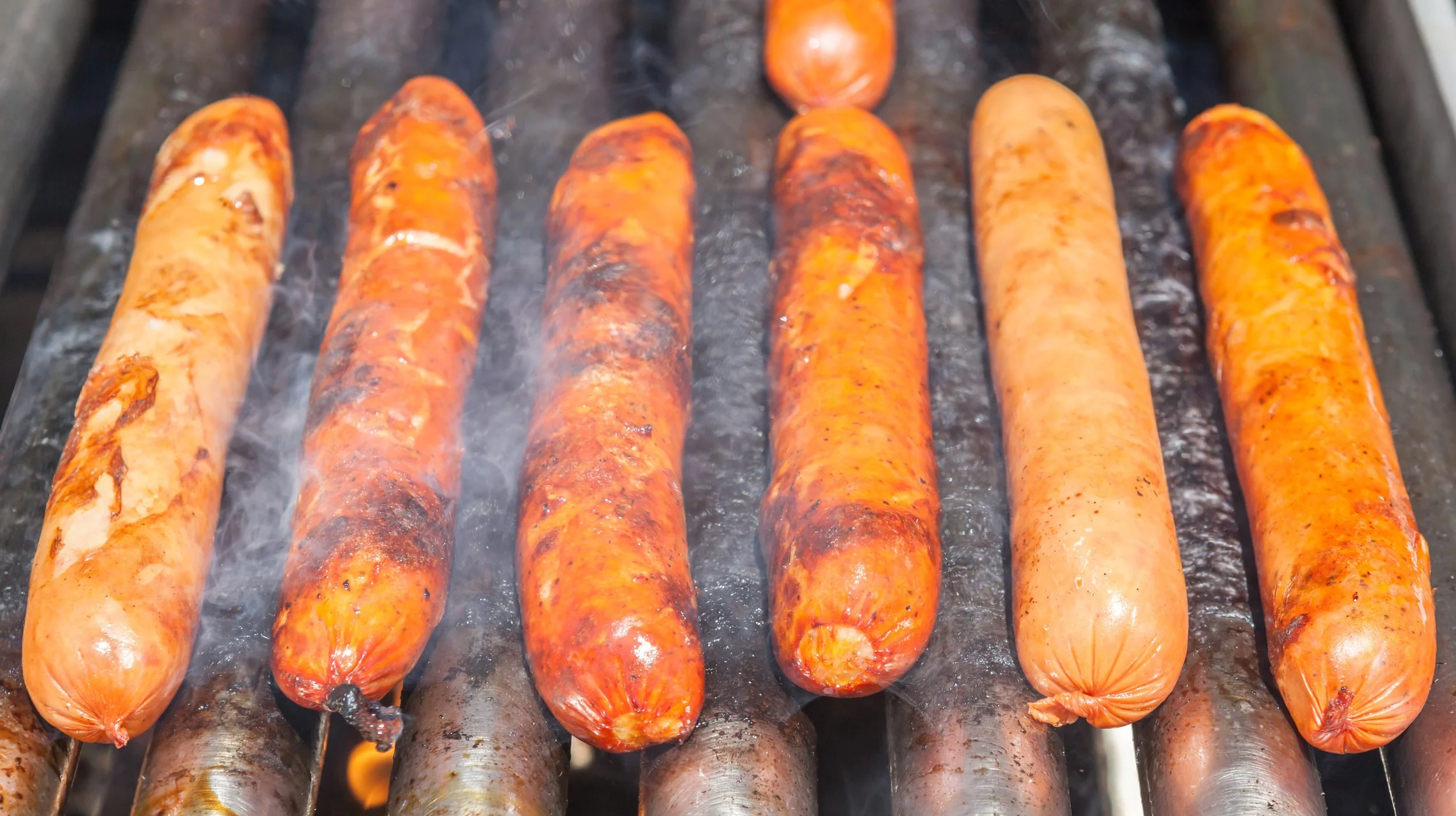 hot dogs on a roller cooking device