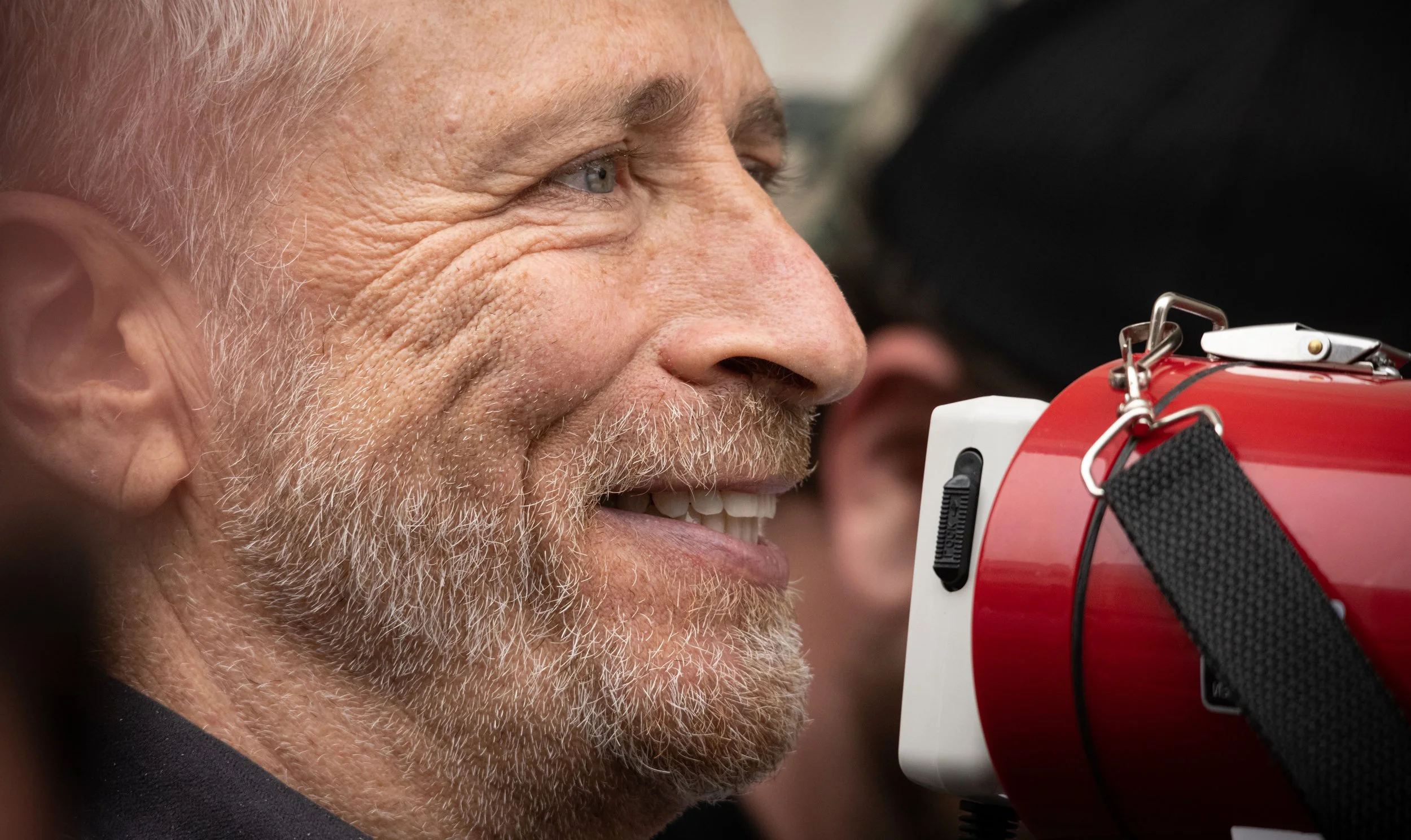 Actor turned activist Jon Stewart speaks to a crowd at a PactAct rally.