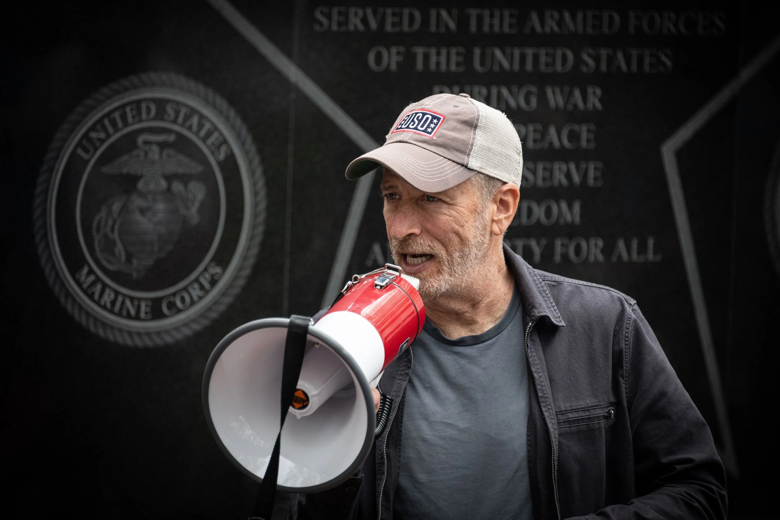 Actor turned activist Jon Stewart speaks to a crowd at a PactAct rally.
