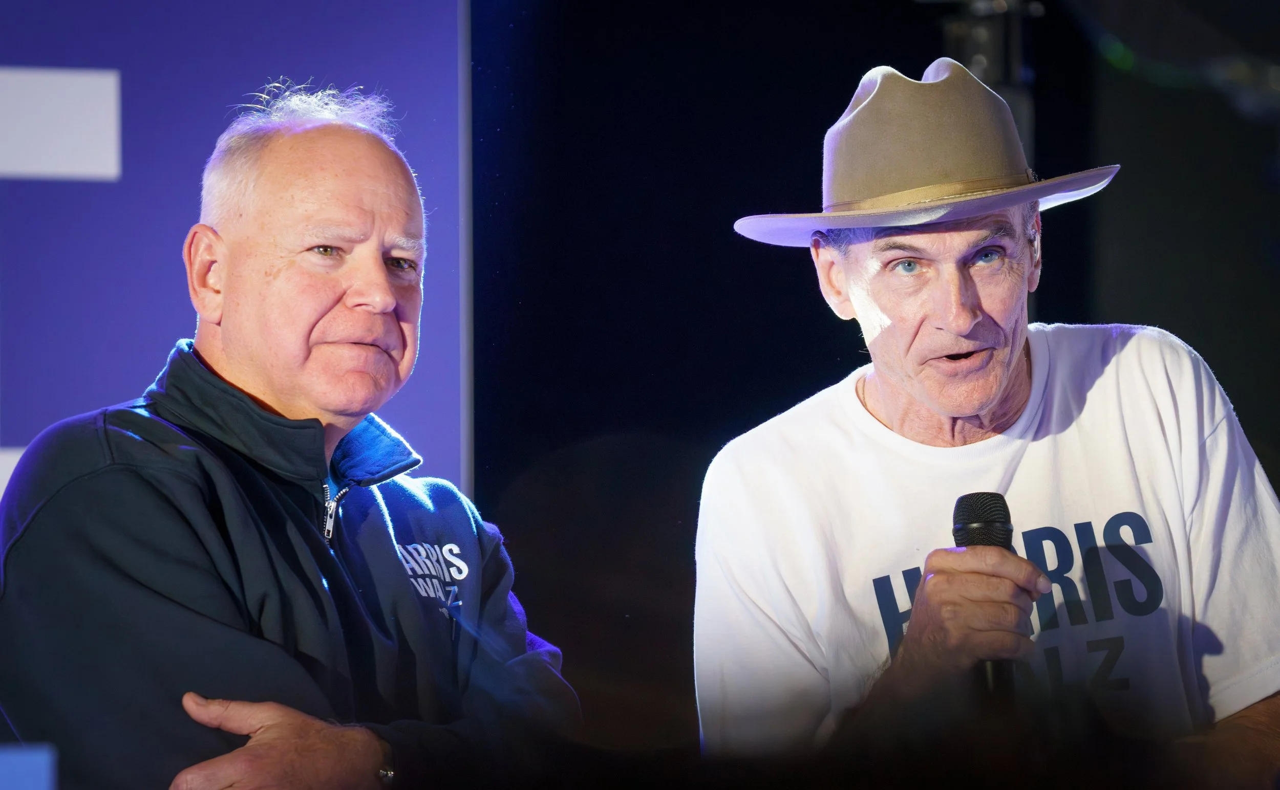 Minnesota Governor Tim Walz and legendary musician James Taylor appear together at a campaign rally.