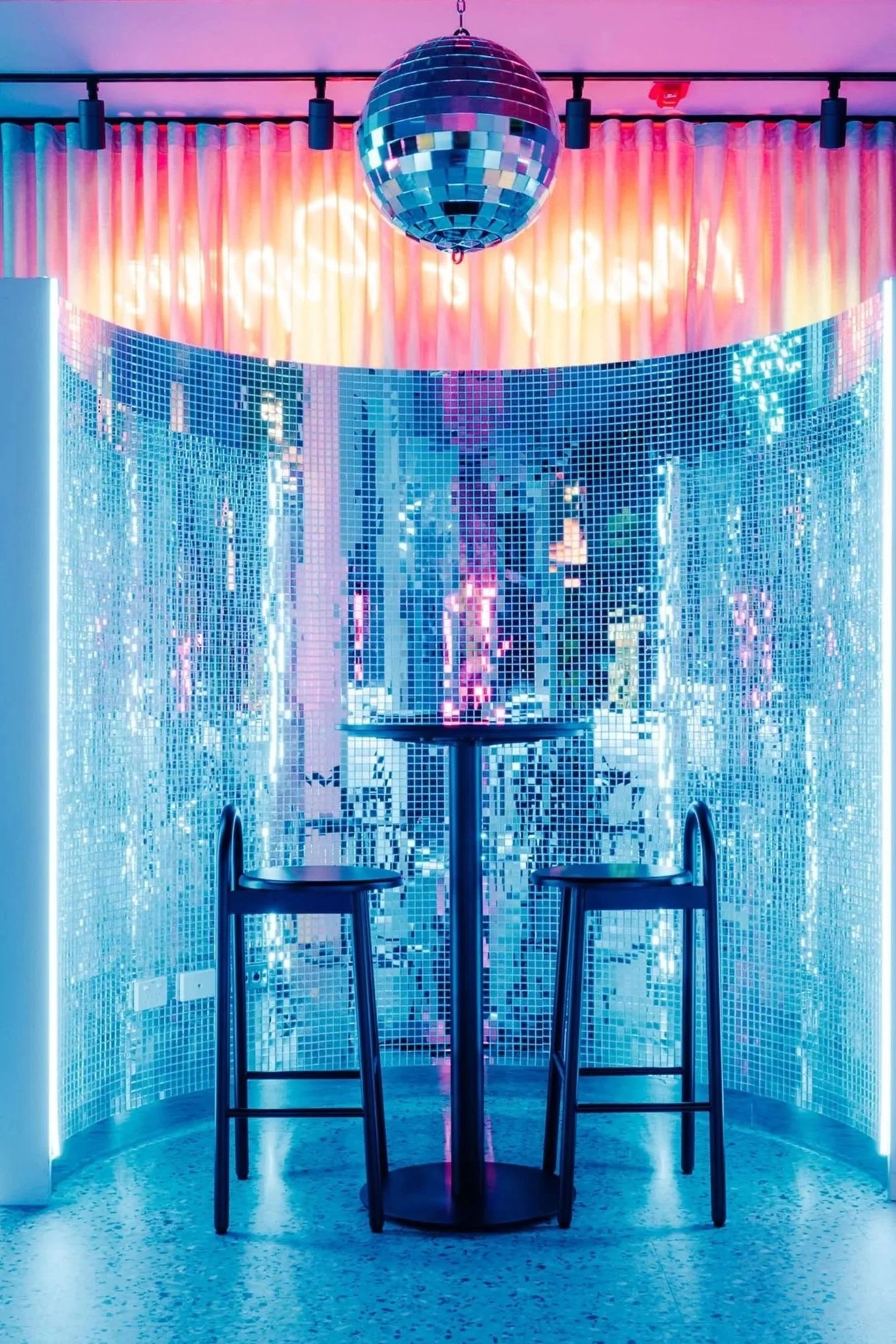 Mar's Poppin Cocktail Bar blue mirror curved seating niche
