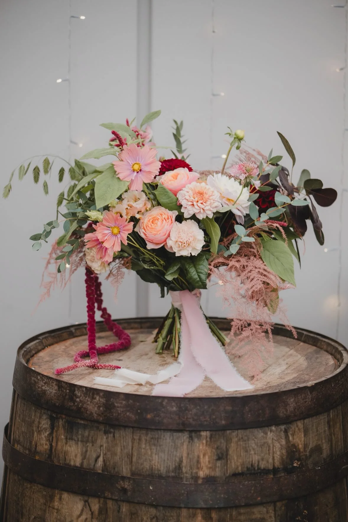 Loose romantic wedding bouquet with soft pink flowers and natural texture by Cornwall wedding florist Escential Blooms