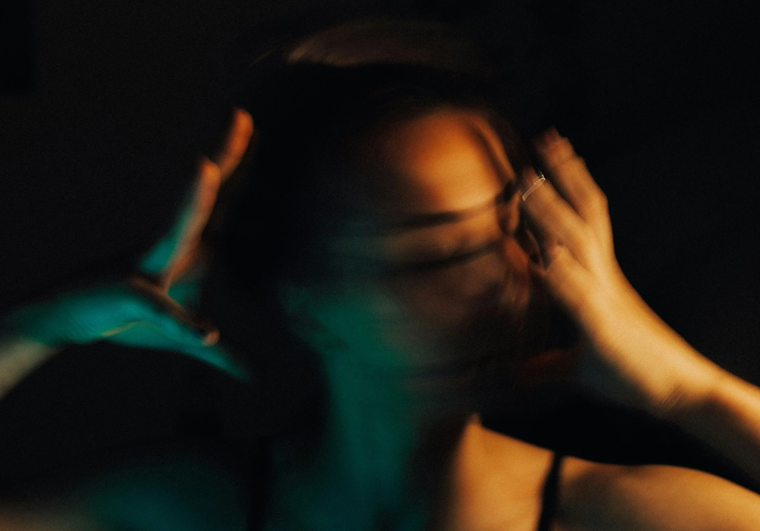 blurry image of a woman moving her head