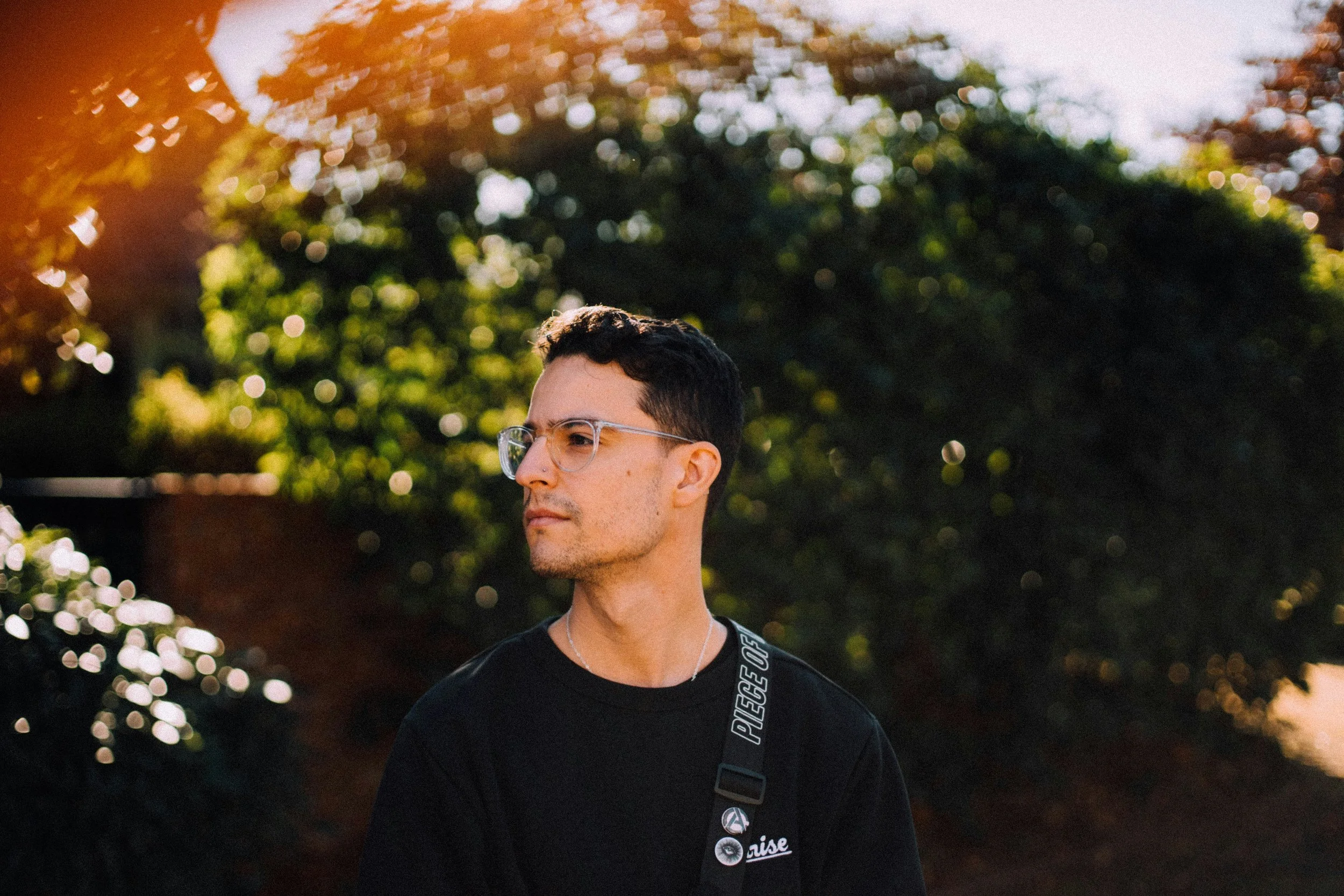 man in black crew neck shirt wearing black framed eyeglasses