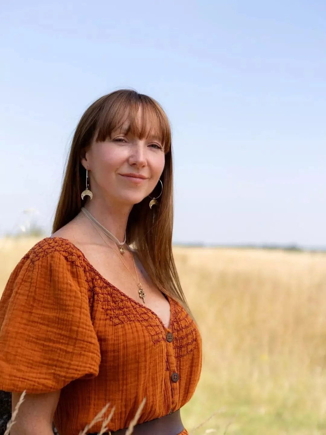Yuliya wears the crescent Moon Charmed hoop earrings in mixed metals bronze and silver from my latest earring collection. Want to change around the charms? I got you covered, choose from the Moons, Stars, Spirals or Womb triangles. 

Swipe for detail