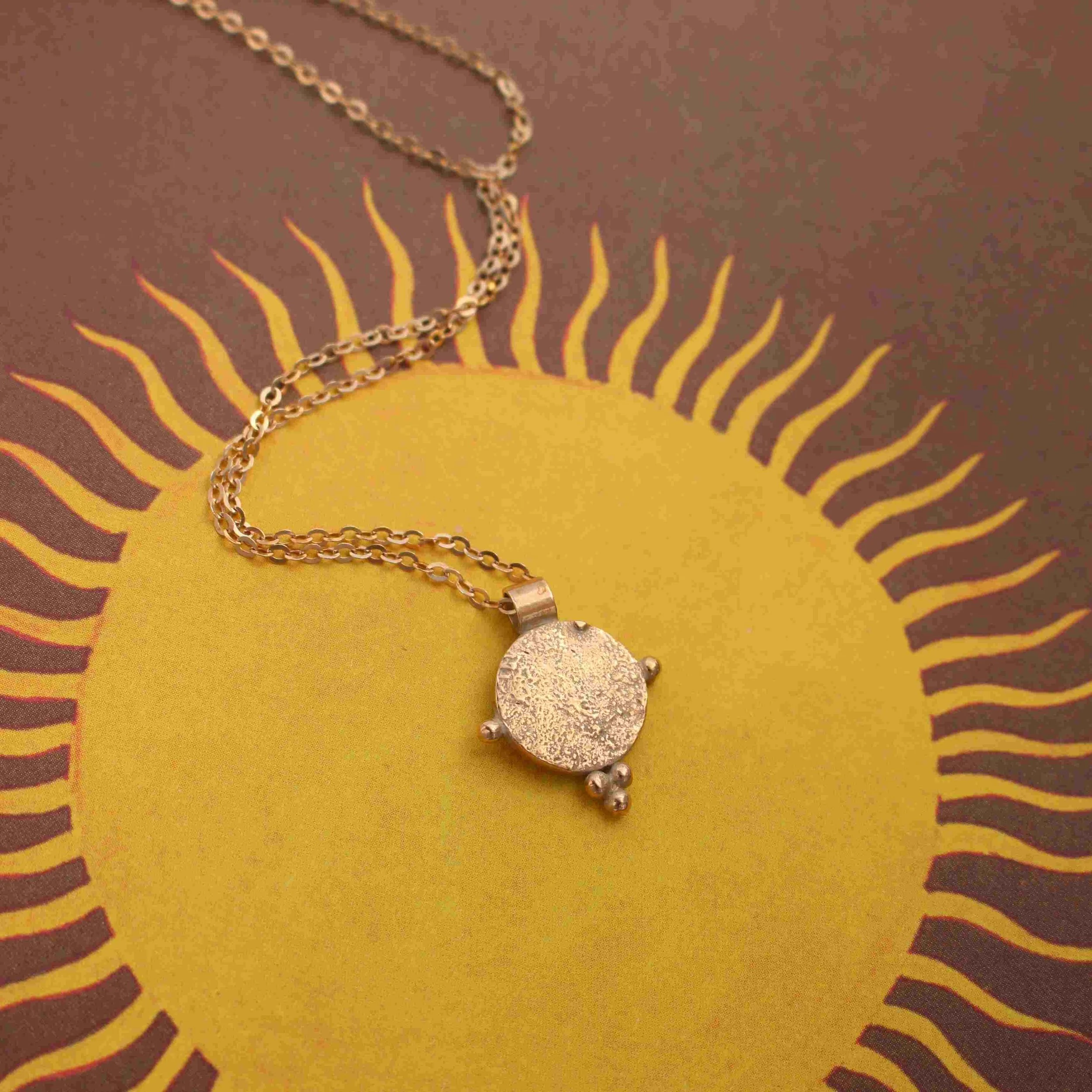 Equinox Pendant in Bronze