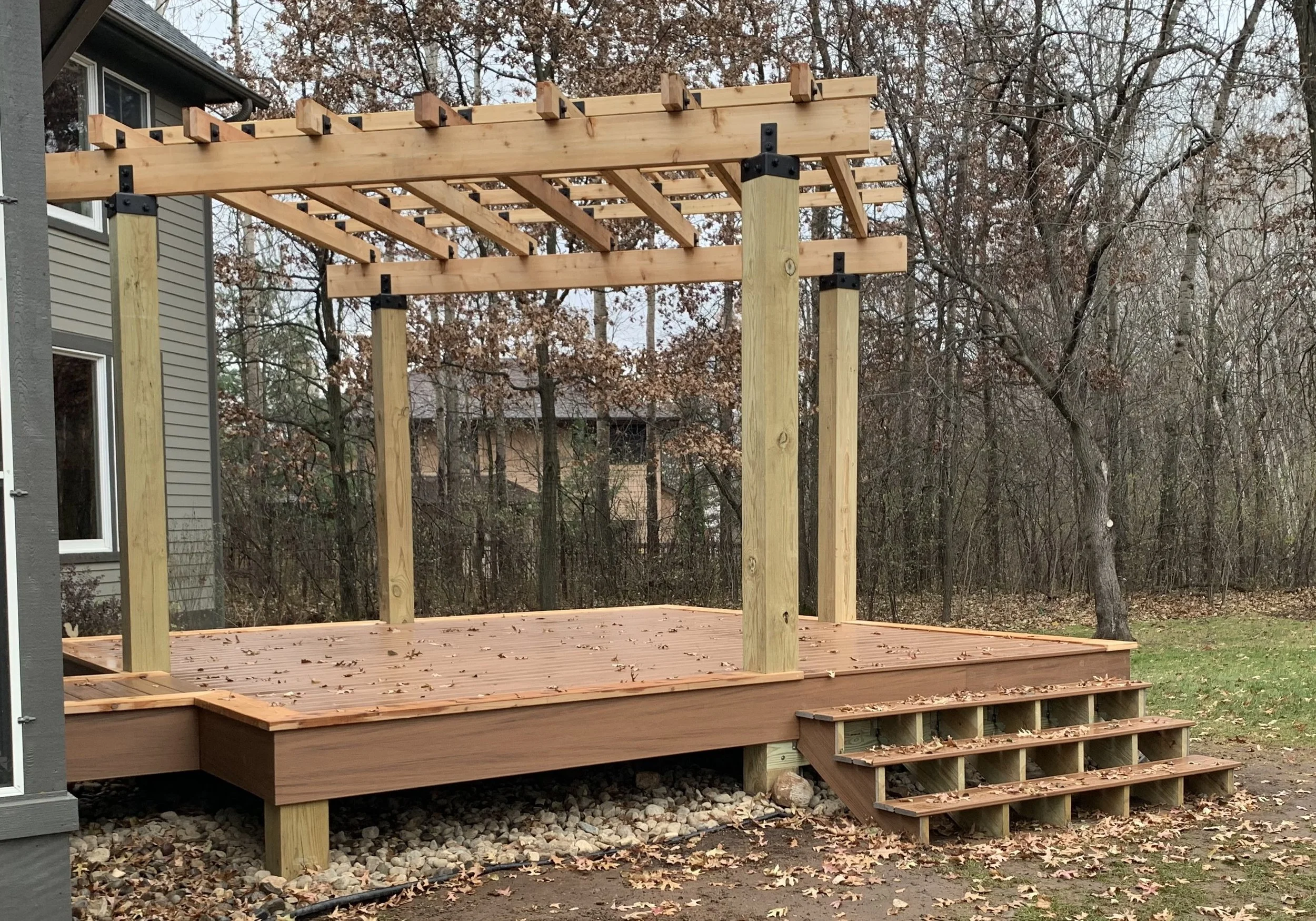 Completed Trex deck with cedar pergola in Stillwater MN backyard
