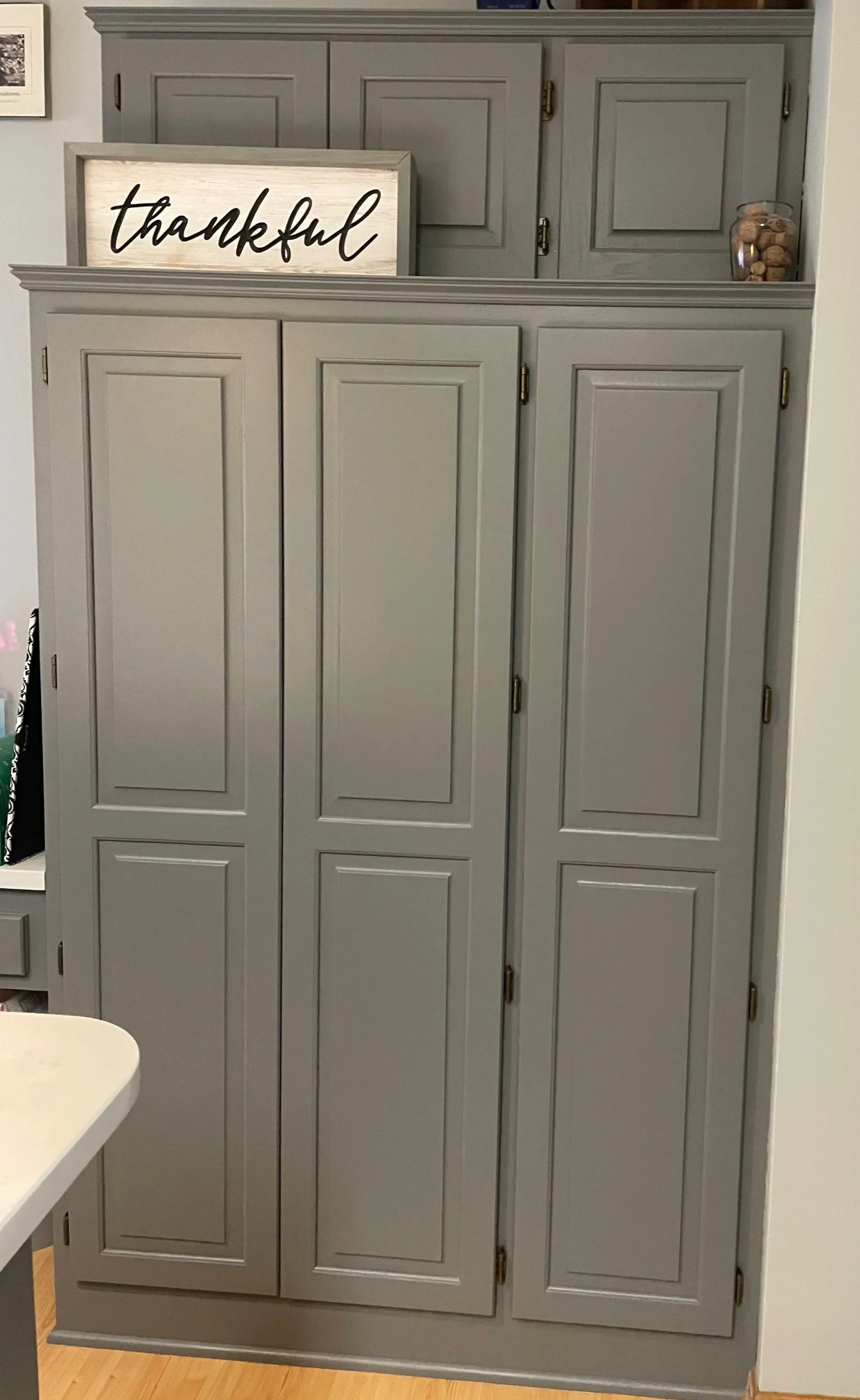 Custom pantry cabinets installed during kitchen remodel in Columbia Heights Minnesota with built-in storage and painted cabinetry.