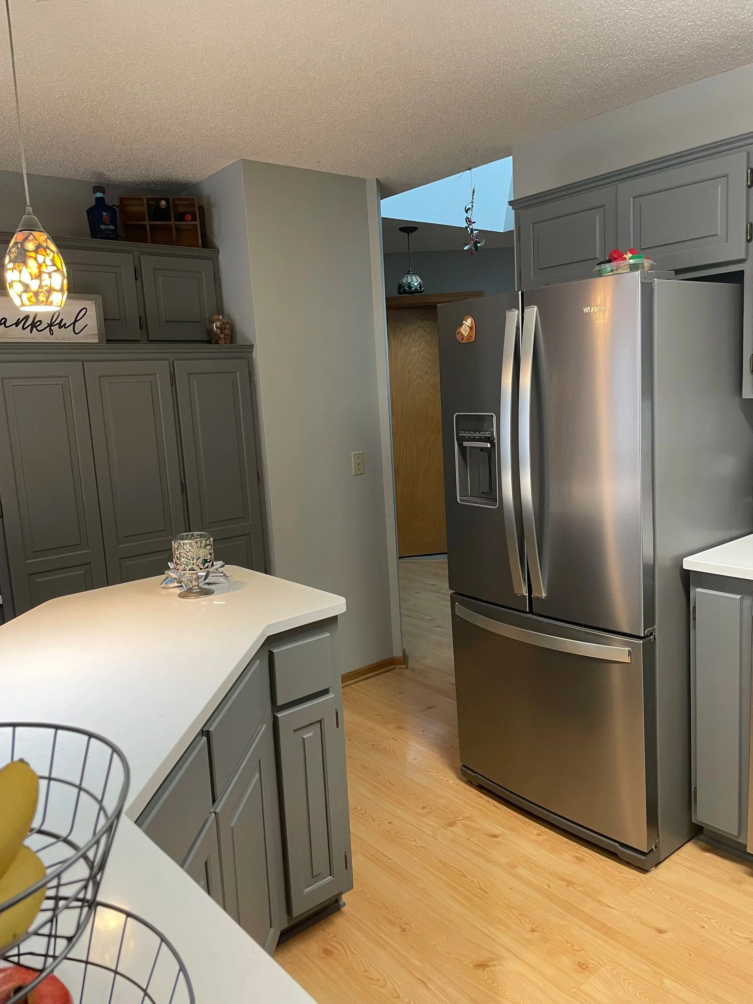 Full kitchen remodel layout with gray cabinets, stainless appliances, and modern finishes in Columbia Heights Minnesota.