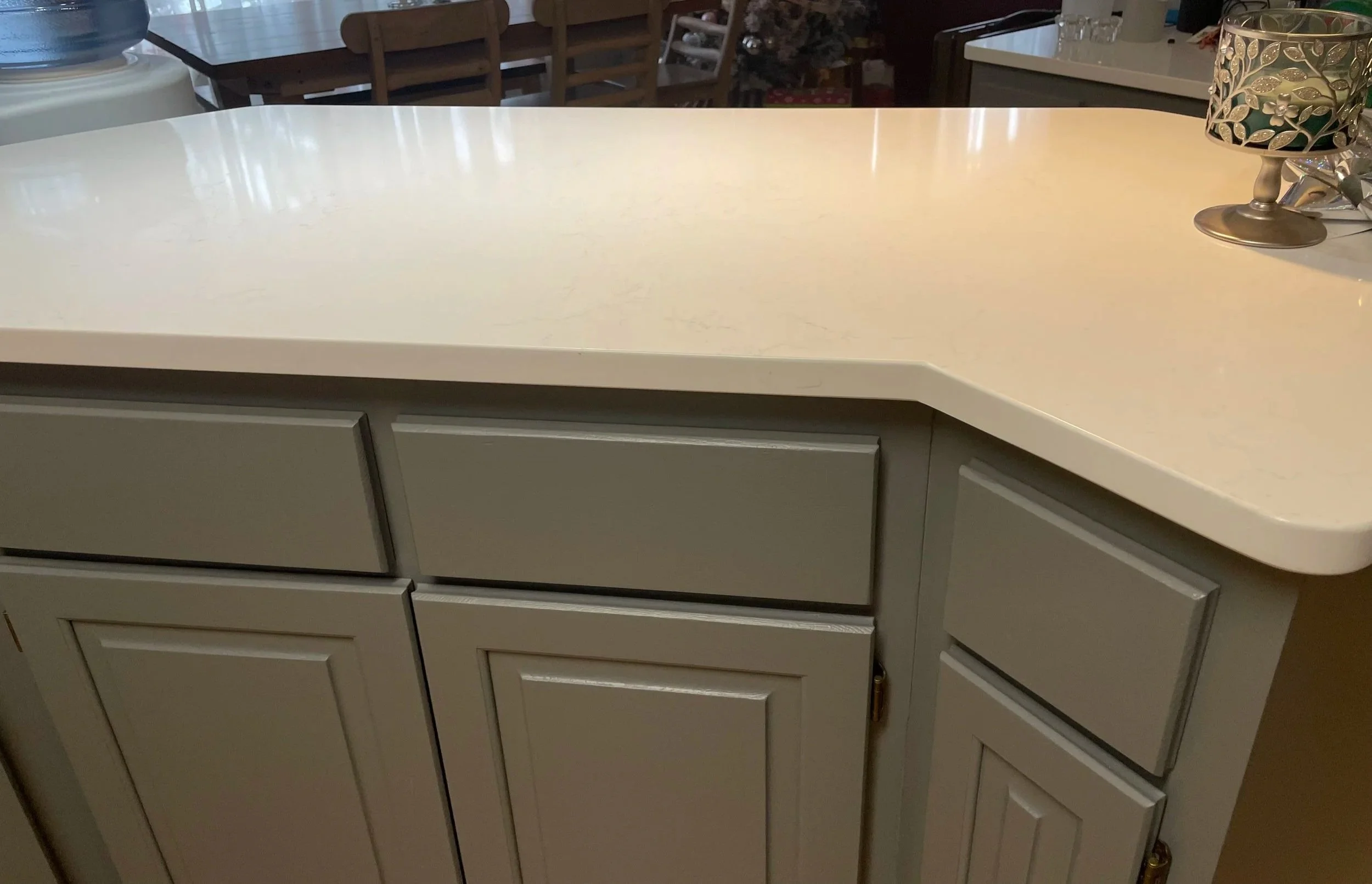 Close-up of gray shaker cabinets and quartz countertop detail from kitchen remodel in Columbia Heights Minnesota.