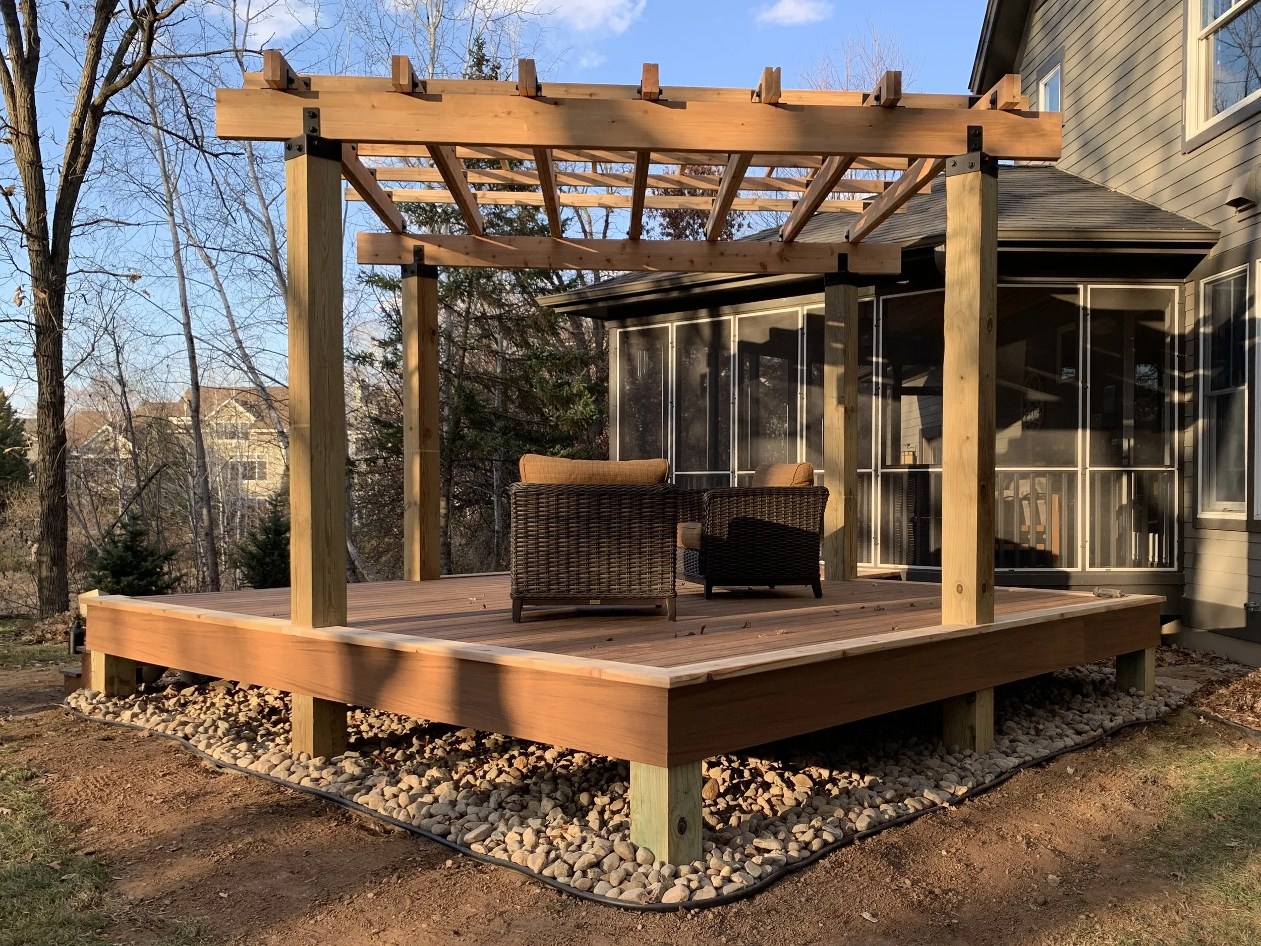 Modern composite deck with cedar pergola built by contractor in Twin Cities MN