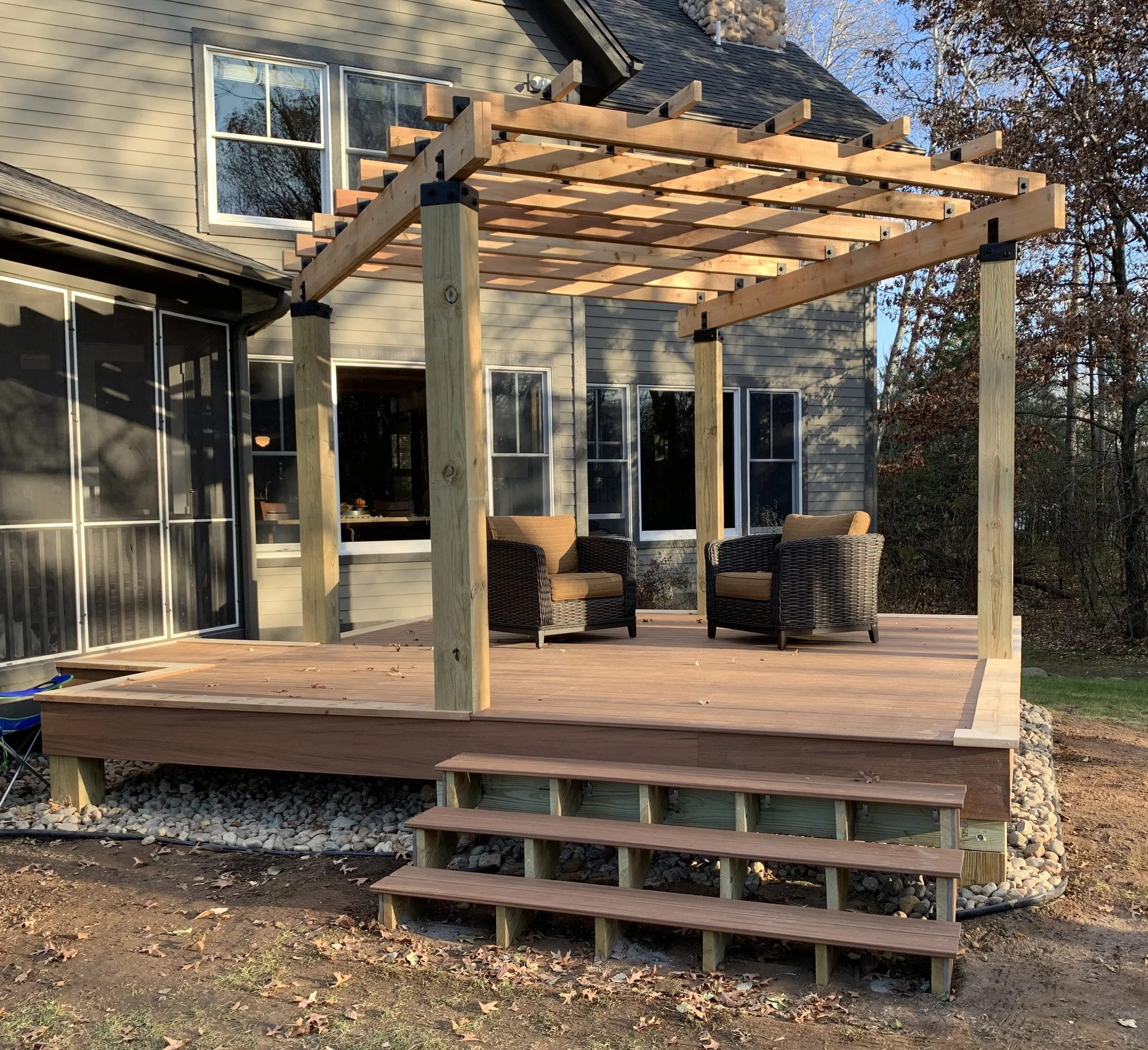 Custom Trex deck with cedar pergola in Stillwater Minnesota backyard