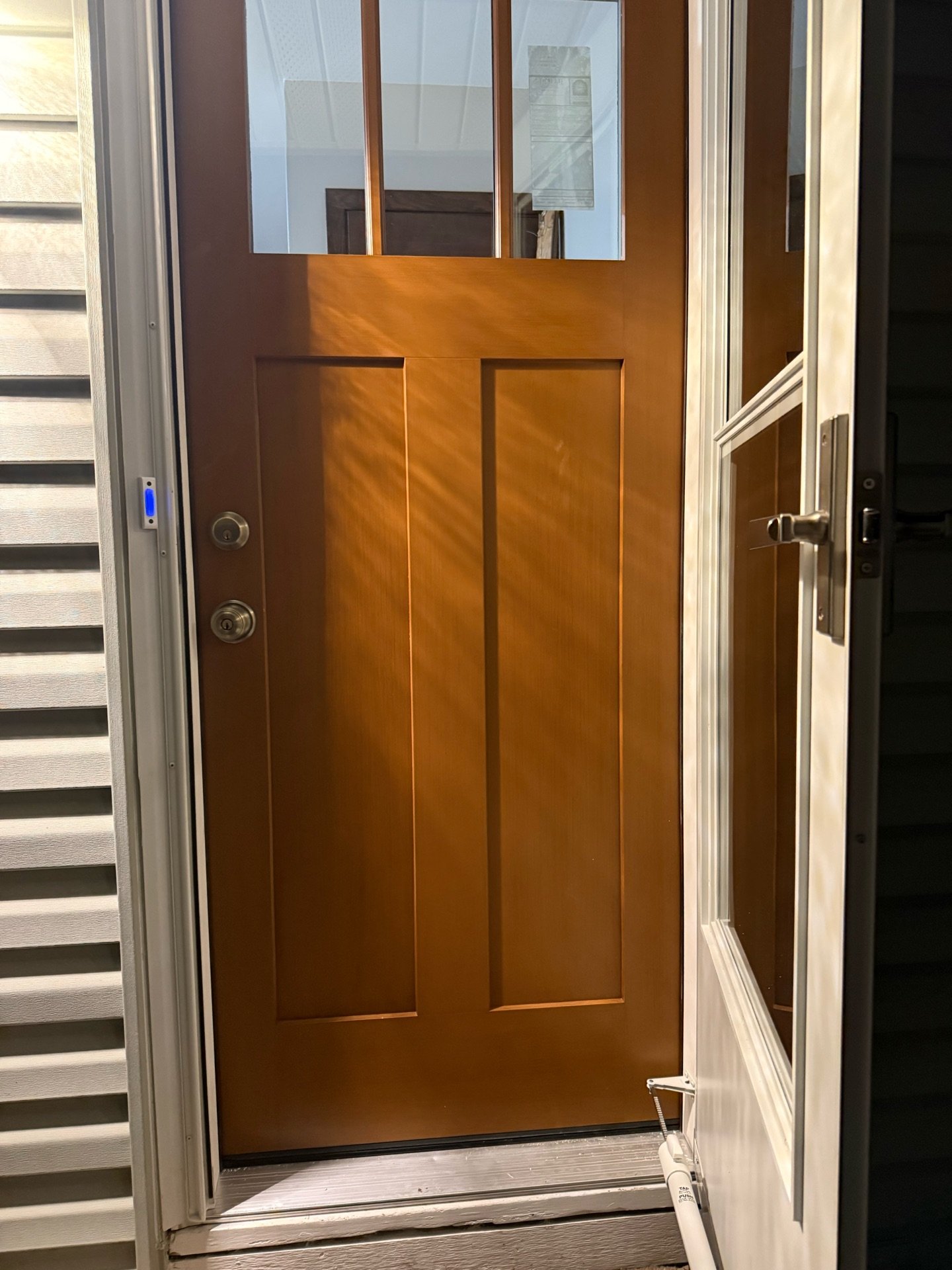 Fiberglass entry door installation with storm door in Roseville, MN