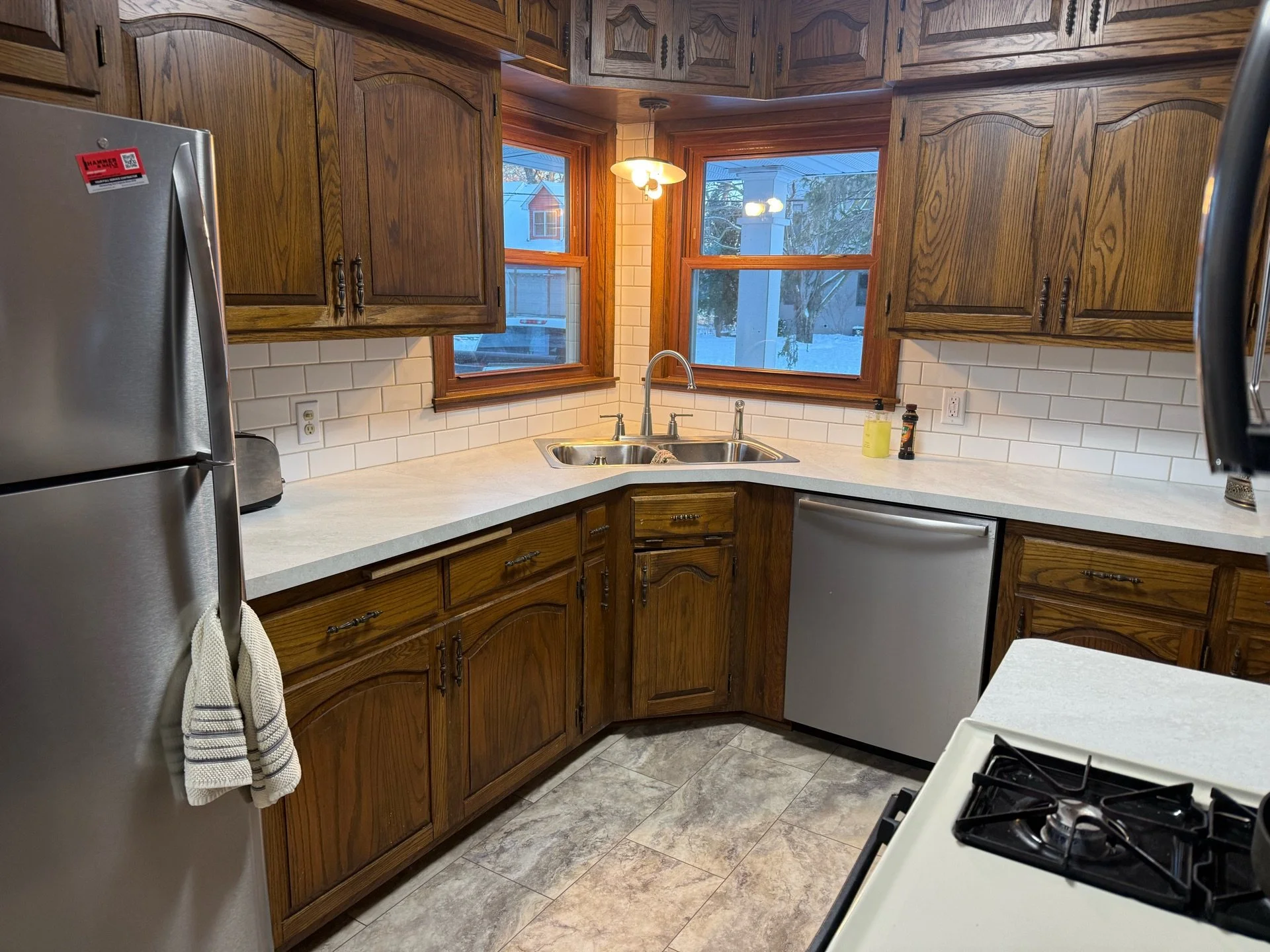 Kitchen remodel with laminate countertops and backsplash in Roseville, MN