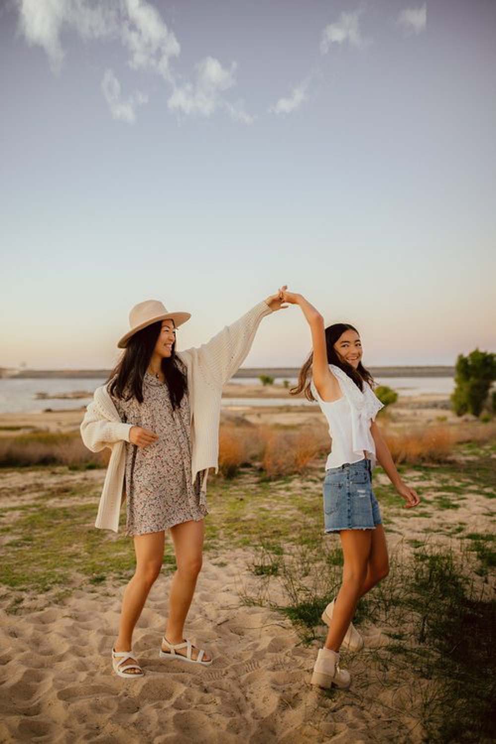 Mother and daughter dancing outdoors Sacramento family portraits.jpg