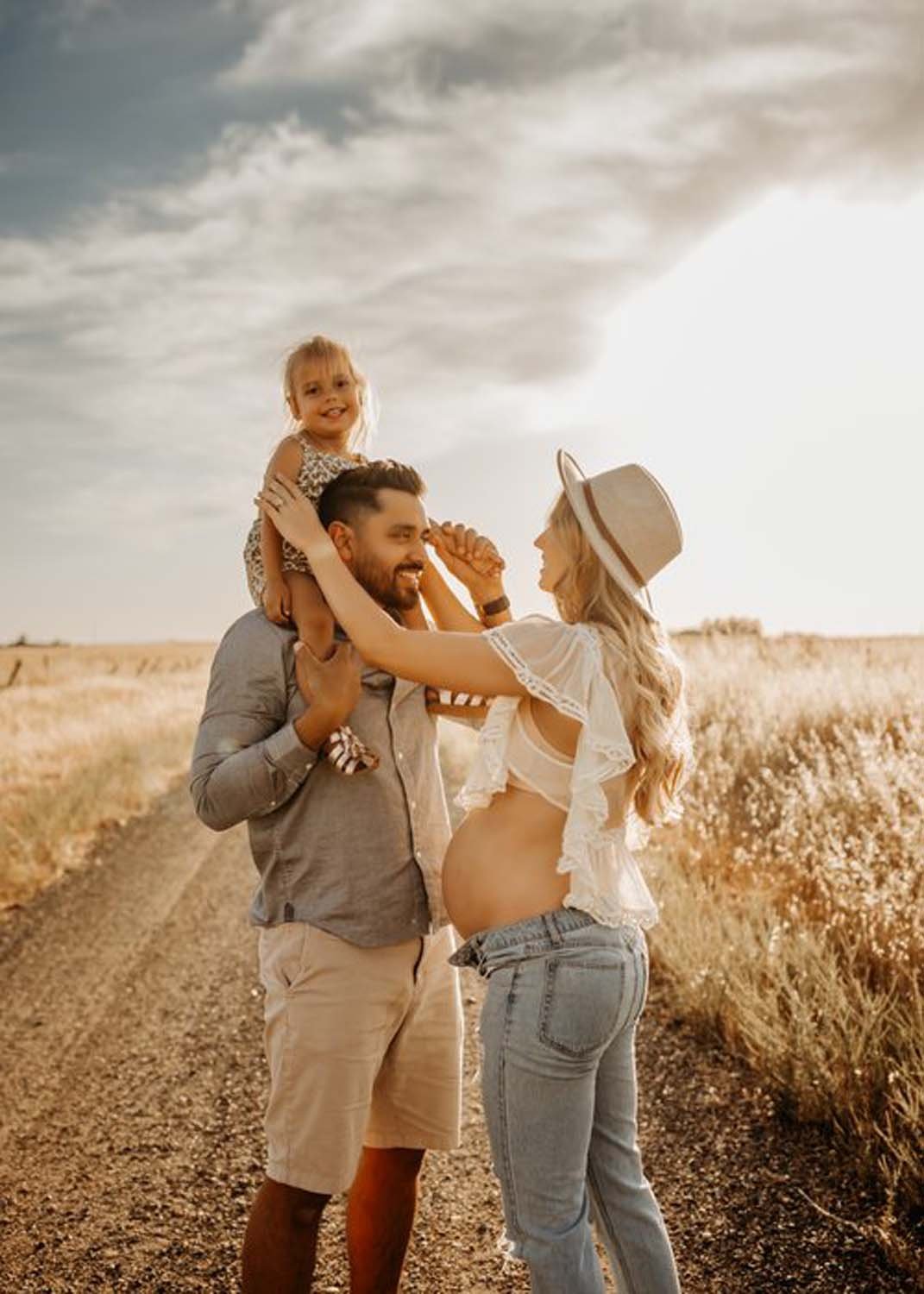 Family on dirt road child on shoulders family photography Sacramento.jpg