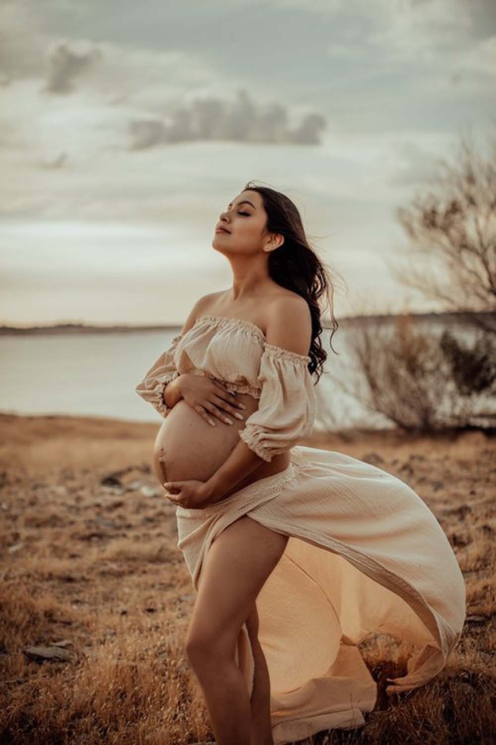Maternity photographer Tsaiti Babella pregnant woman by water at sunset Sacramento.jpg
