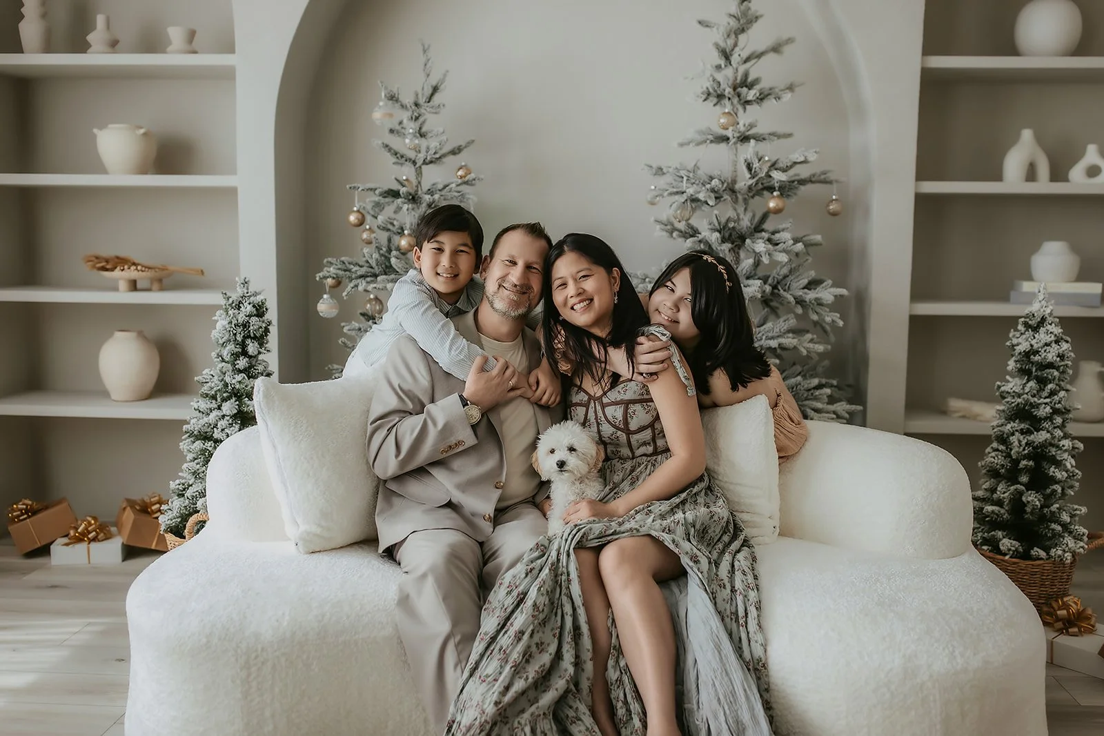 "Christmas petite sessions El Dorado Hills, family in studio with frosted tree in arch