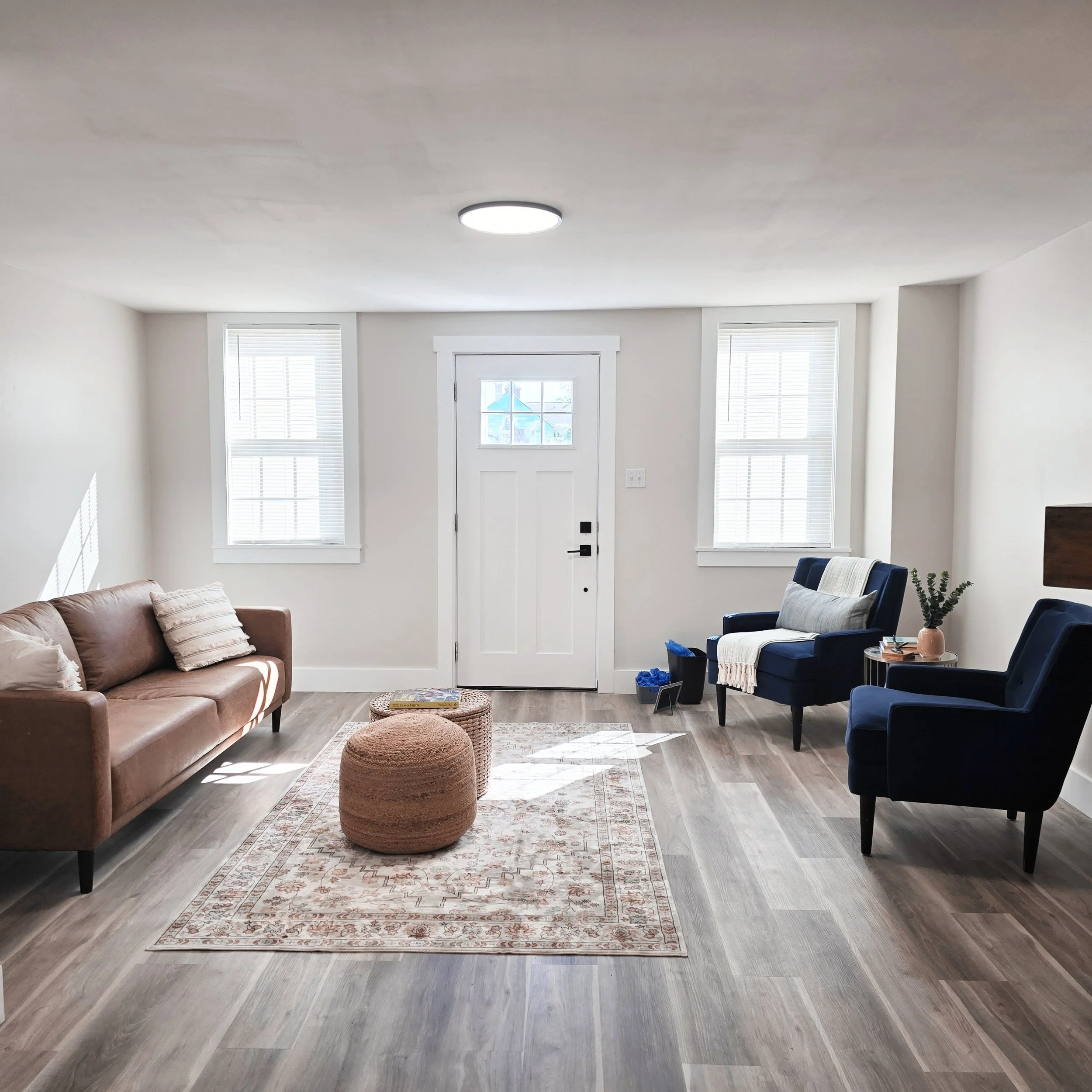Professionally staged living room in a Columbia, PA home featuring stylish furniture, layered décor, and a welcoming layout.