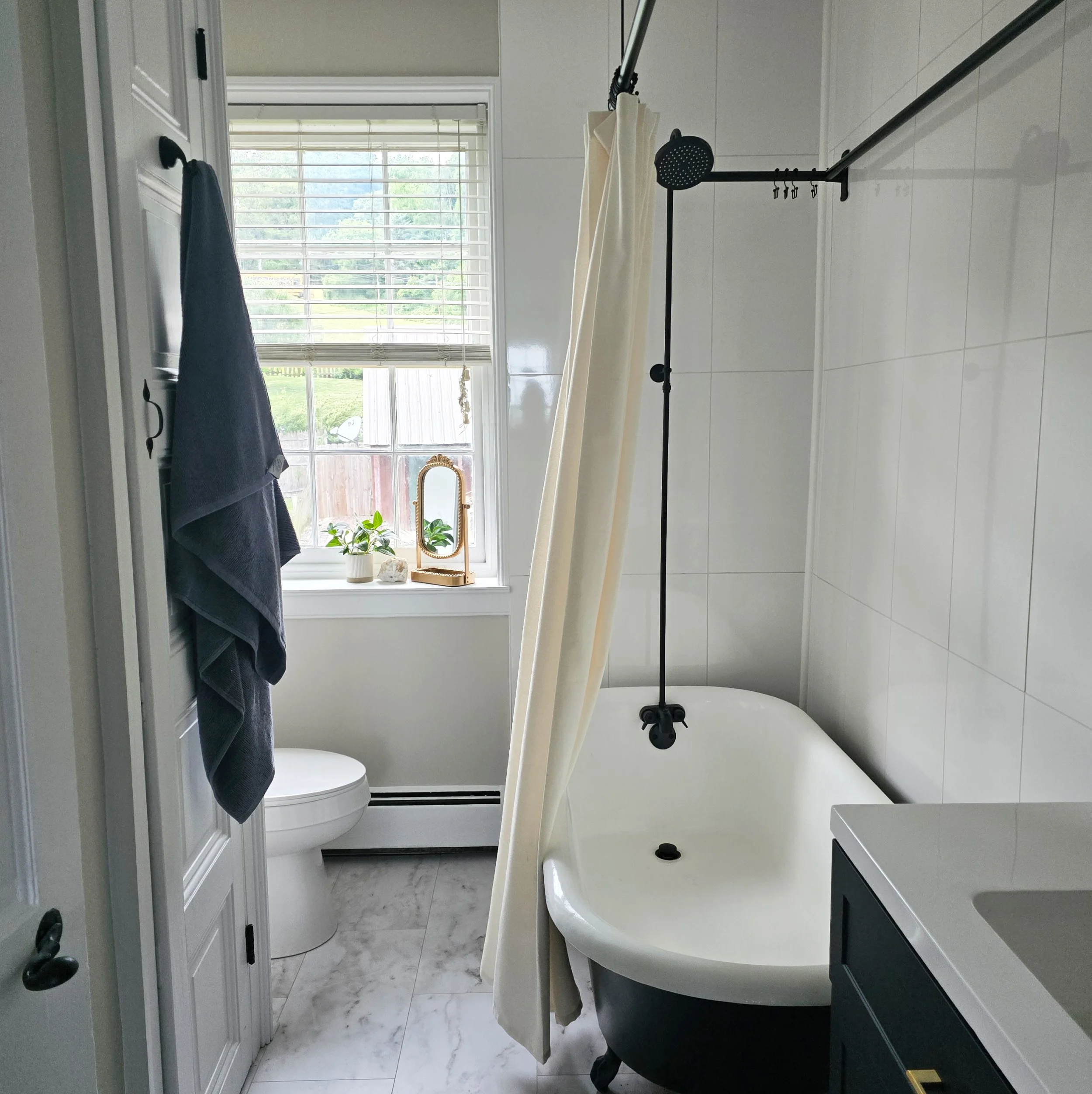 Bright primary bathroom in a Columbia, PA Colonial Farmhouse featuring modern fixtures, elegant finishes, and a relaxing spa-like atmosphere.