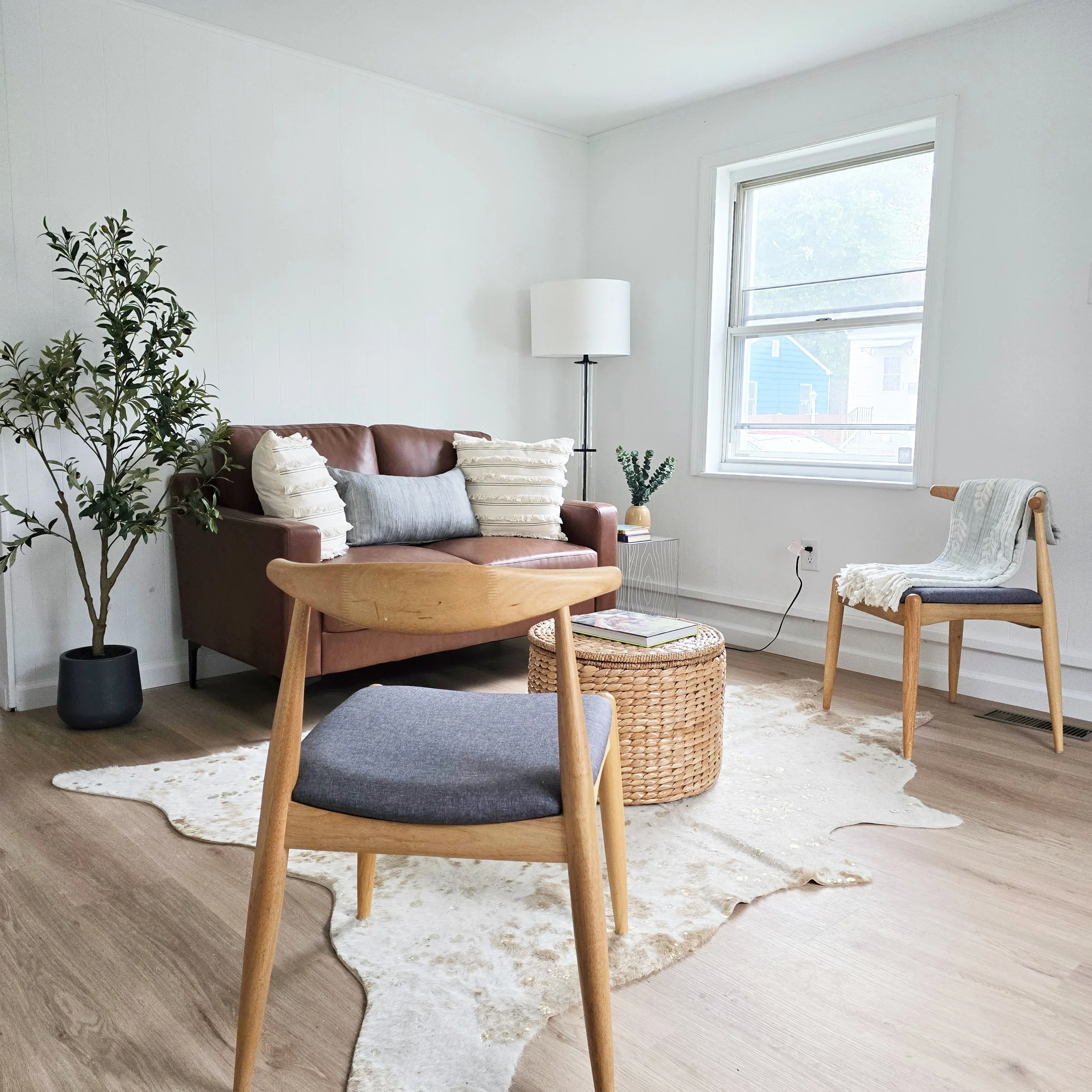 Bright, professionally staged living room in a Lancaster, PA home featuring neutral furnishings, natural light, and thoughtfully selected décor.