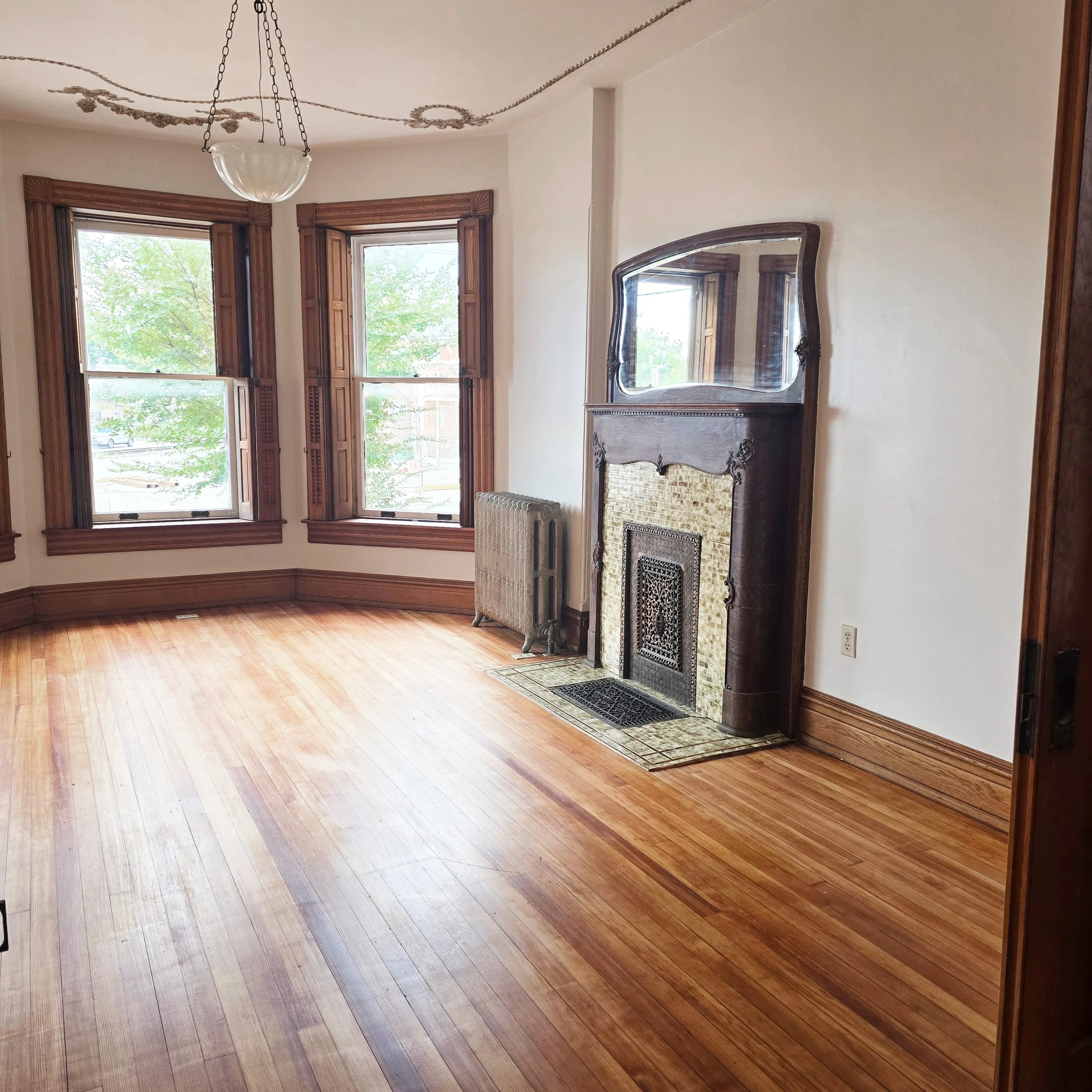 Professionally staged primary bedroom with large windows and abundant natural light in a Hanover, PA home.