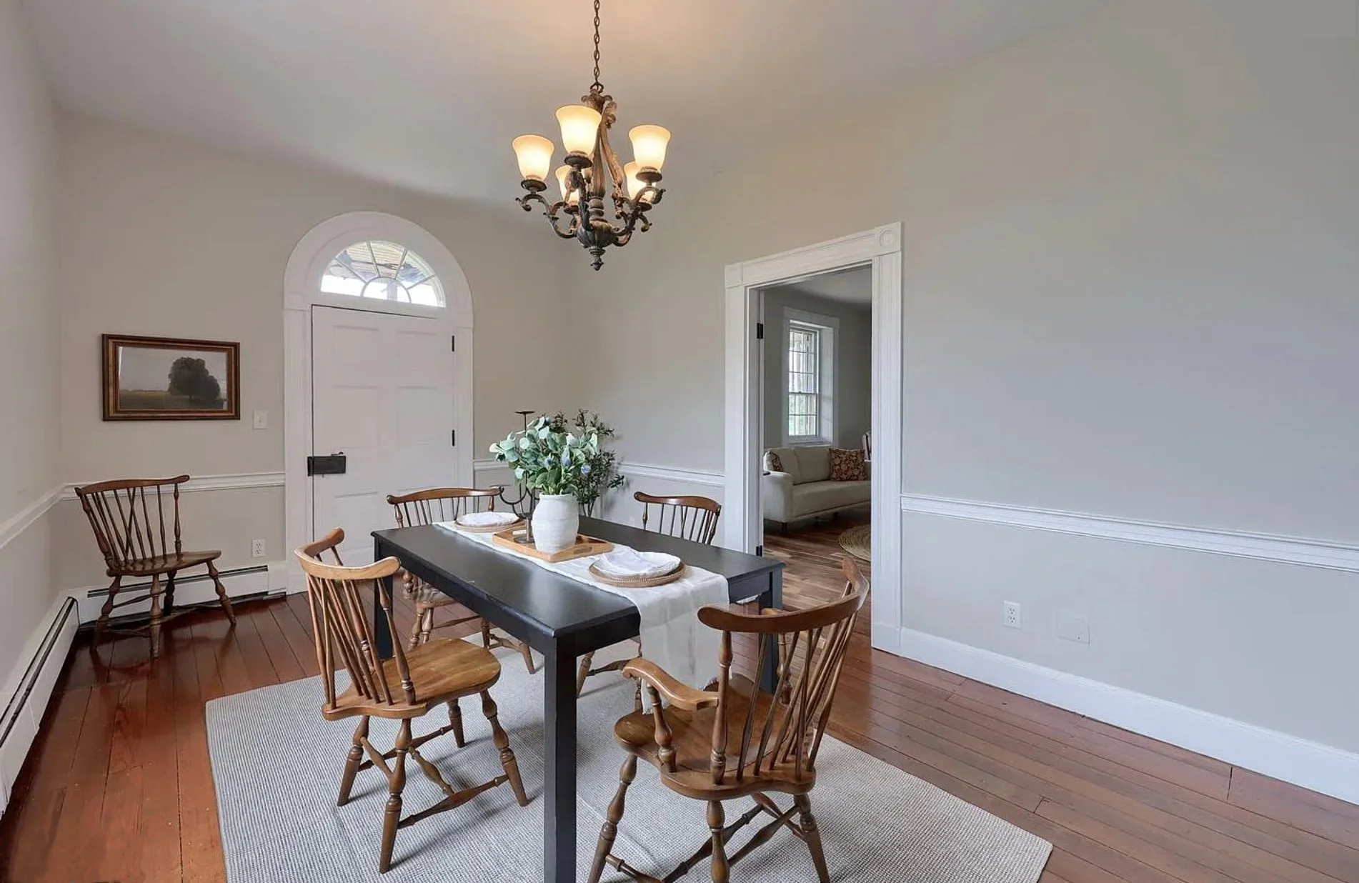 Professionally staged dining room in a Columbia, PA Colonial Farmhouse featuring a beautifully styled dining table, neutral décor, and an inviting atmosphere.