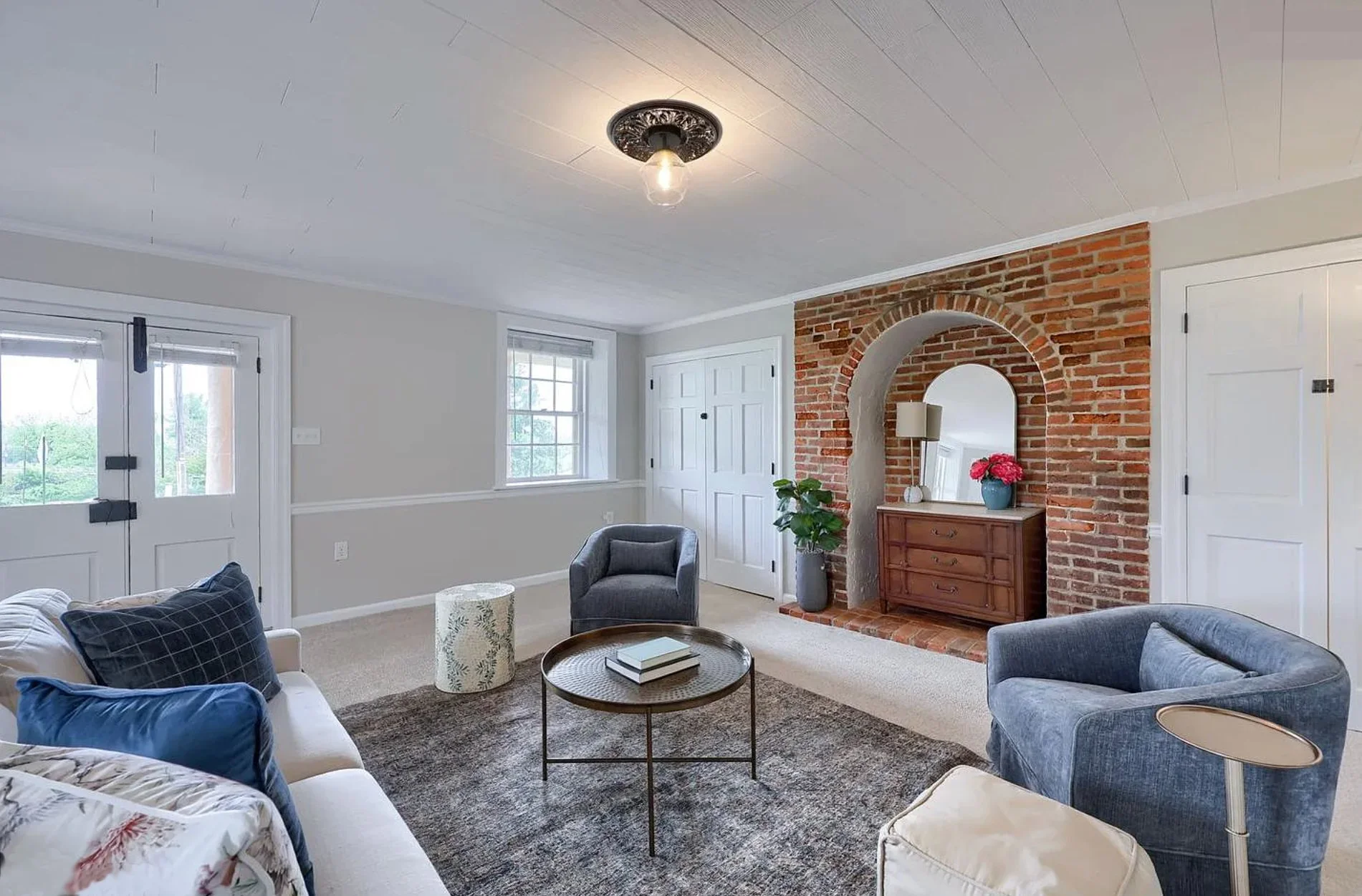 Professionally staged living room showcasing warm, inviting design by Sapphire Home Staging serving South Central Pennsylvania, Greater Philadelphia, and northern Maryland.