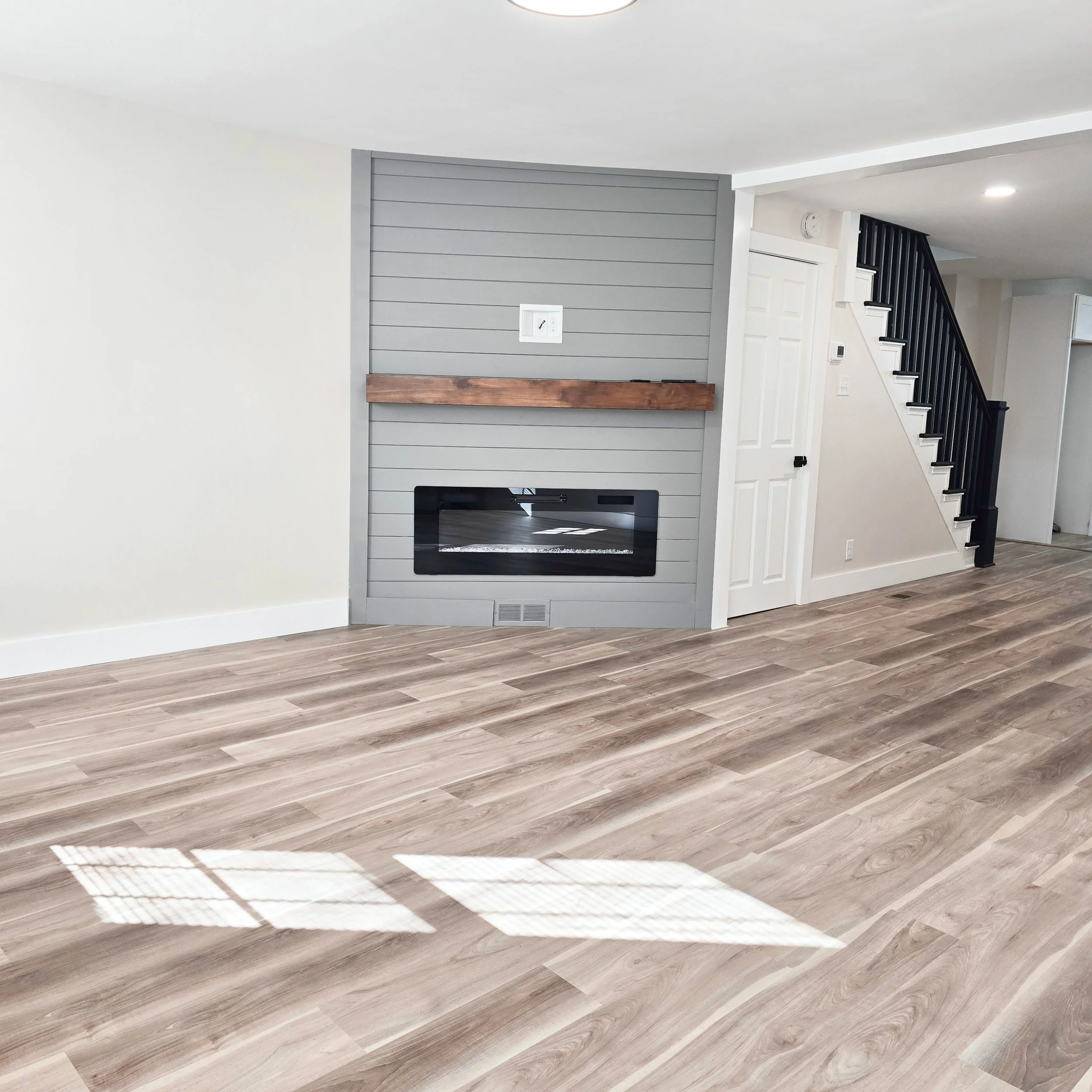 Vacant living room in a Columbia, PA home before professional staging, showing the open layout and potential of the space.
