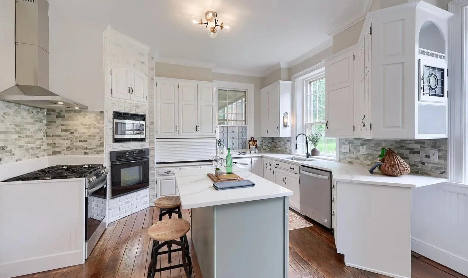 Professionally staged kitchen in a Columbia, PA Colonial Farmhouse featuring updated appliances, modern finishes, and a bright, welcoming design.